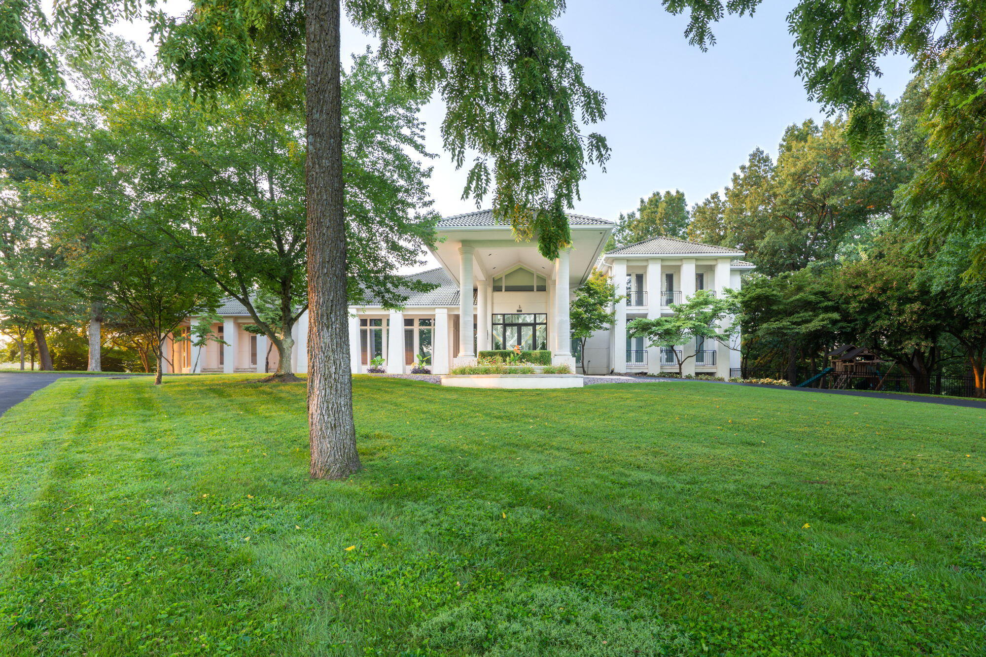 Live in unparalleled LUXURY in this one-of-a-kind estate between Highland Springs and Millwood! Situated on a lush and private 3-acre lot, this property boasts over 10,000 sf of stunning contemporary architecture and top-of-the-line features inside and out. Step from the porte-cochere into the dramatic foyer, and you'll FEEL the quality through details like Portuguese limestone floors, 8' solid wood doors, plantation shutters, custom beams, and various high-end fixtures and modern design elements throughout. Follow through to the wall of rear windows overlooking the crown jewel outdoor space! The absolutely epic in-ground pool and spa is surrounded by a massive covered outdoor kitchen (grill, cooler, sinks, cooktop), built-in splash pad for the kids, dedicated bathroom, and propane fire pit with fire bowl columns (amazing at night)!The home provides 6 bedrooms, office, 5 full bathrooms, 2 half bathrooms, kitchen with Sub-Zero and Wolf appliances, butler's kitchen, 3 fireplaces, 3 dishwashers, and 2 laundry rooms! There's no shortage of tech either with a theater room, Crestron home automation for lighting and media, and meshed wireless Internet access points. The main-level primary suite has separate sitting area, heated bathroom floors, huge closet, and its own private side courtyard with hot tub. Recent remodel includes new primary shower, full remodel of upstairs bathroom, conversion of upstairs bedrooms to Jack & Jill layout, and conversion of basement bathroom from half bath to full. There's also a motor court with 8 garage stalls: 4 attached, plus 4 detached with its own HVAC that would make a fantastic gym or studio space. The secure lot has a fenced kids' playground area, irrigation, extensive metal fencing, and private gate with phone access and remotes. Too many features to list! See the attached list for full list of features and updates. This unique property is a true gem of the Springfield area; don't miss your chance to call this one HOME!