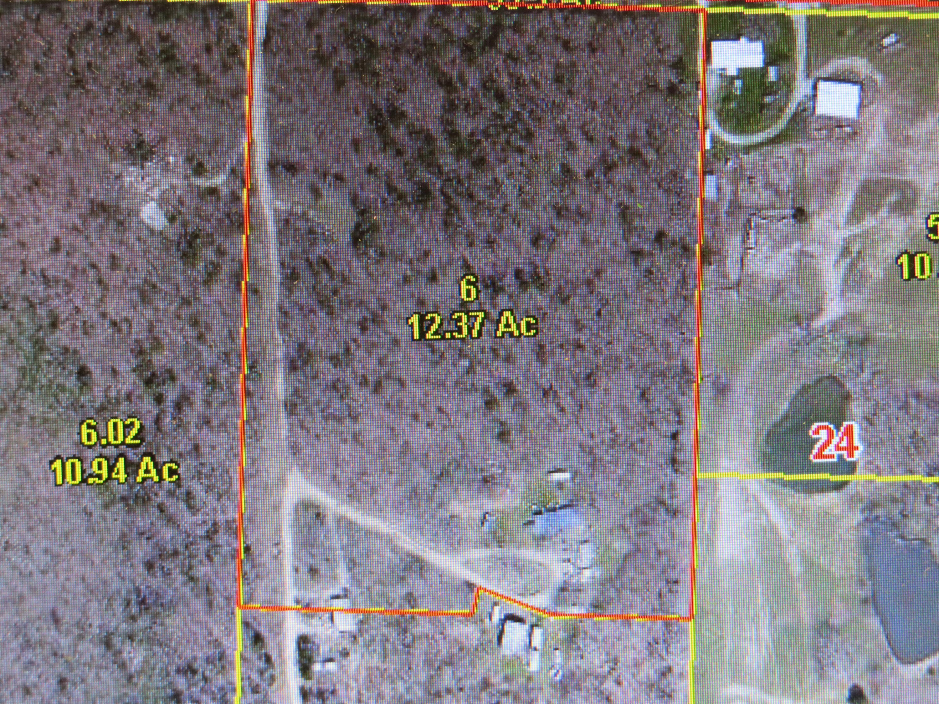 Located along a state highway and a county road. 12 semi secluded acres of mostly timber close to Pomme de Terre Lake. Property has electricity, a well, and a septic in place.  A great location to develop a weekend getaway,  or a permanent residence.   There is a an 1979 bricked double wide home placed over a basement on the property.  No value is being given the double wide due to the condition of the basement and the interior of the home.