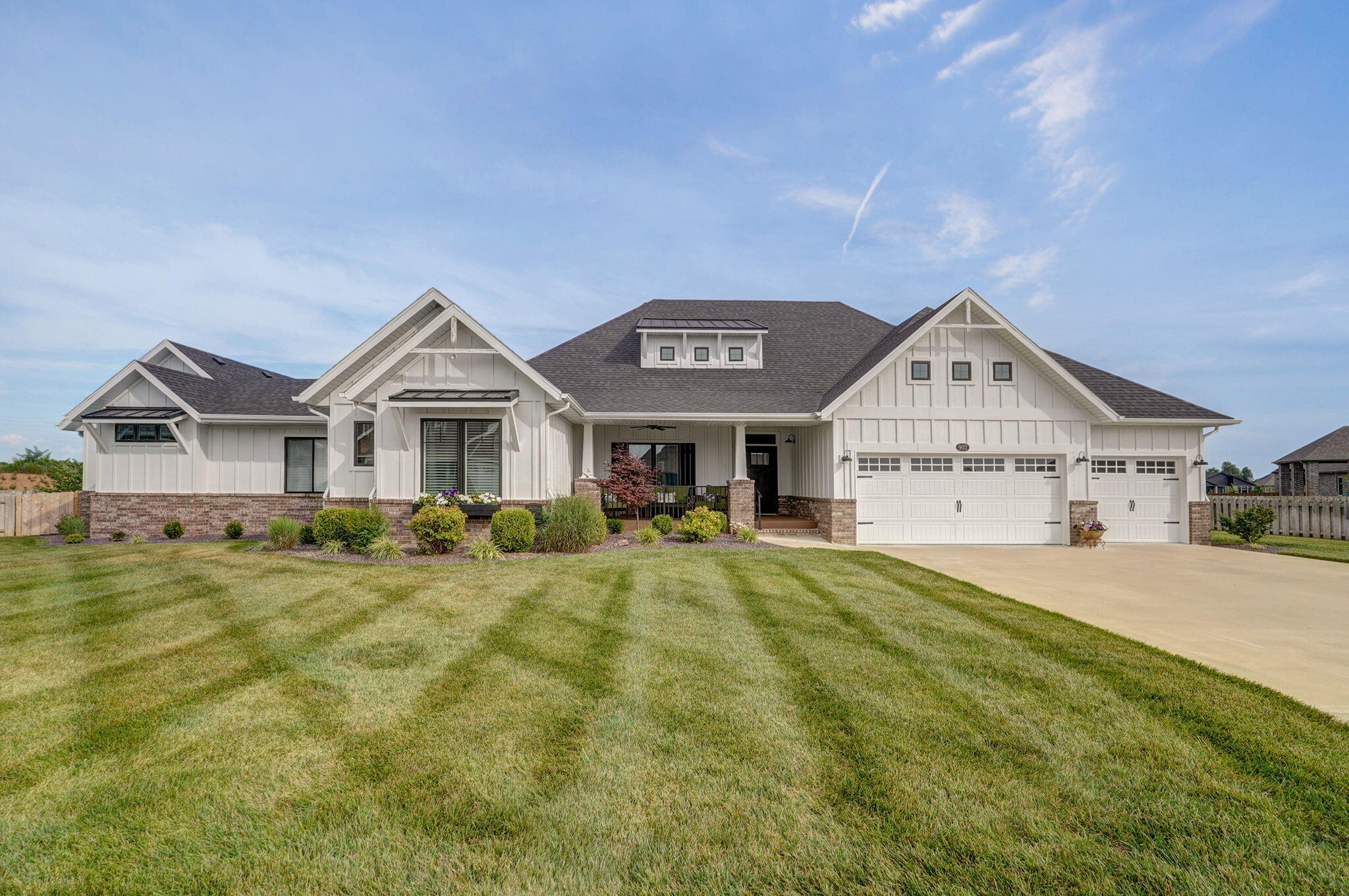 This is the one you've been waiting for Nixa!! Located in the Village of Roundwood at Wicklow and you will feel right at home when you pull into the drive of this property. The exterior is craftsman inspired with a lovely covered front porch, extensive custom landscaping and an interior with over 3800 sq ft all on ONE LEVEL! Perfectly situated on a large lot located on a cul-de-sac. The solid wood front door will open to a  meticulously maintained space with an open floor plan.  A large kitchen features quartz counter tops, a hidden pantry, and casual dining nook. There is also a formal dining room, 2 living areas separated by a beautiful gas fireplace. There are a total of 5 Bedrooms, 3 full bathroom with multiple master suites! The extras in this home are awesome; a wet bar, 2nd laundry,  large walk in closets, built in benches in large showers, soaking tubs, spray in insulation crawlspace with hvac venting, covered front porch and covered/screened back porch, 3 car garage and so much more. An expansion was completed in 2022 by original builder creating the additional space and making it perfect for those with needs for space for extended family members or  buyers wanting a home with all the amenities that they could ever want!