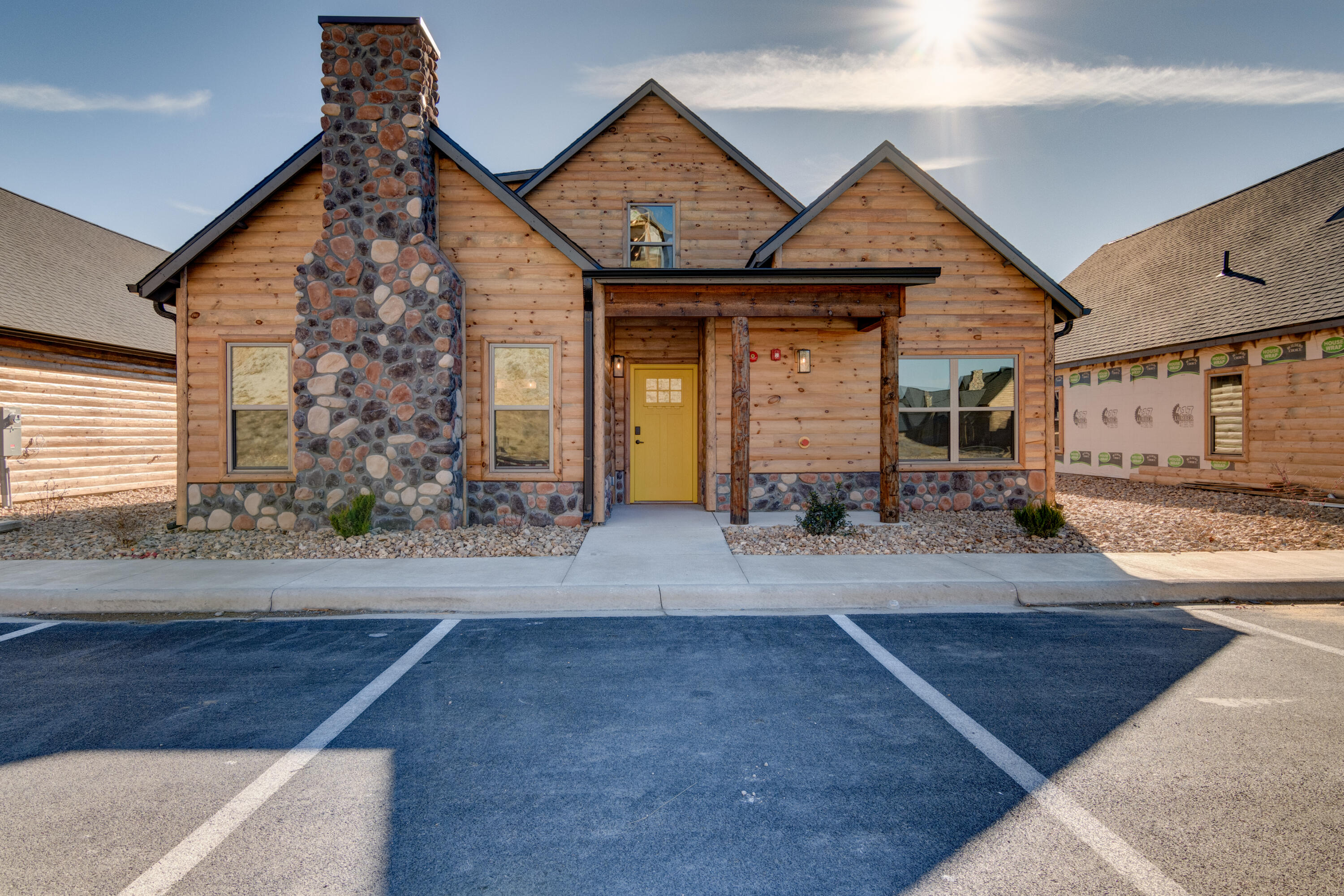 Welcome to your rustic haven, ideally located near shows, shopping, entertainment, and Silver Dollar City. This 5-bedroom, 5-bathroom cabin-style retreat offers the perfect blend of tranquility and convenience. Unwind by the beautiful fireplaces in the living area and primary bedroom, or enjoy the open floor plan and loft living space for gatherings. With spacious patios, this 2024 construction is ready for your personal touch. Whether you're seeking a lucrative investment or a peaceful getaway, this property promises the ultimate Ozarks experience. Schedule your viewing today and embrace the allure of rustic luxury in an unbeatable location.
