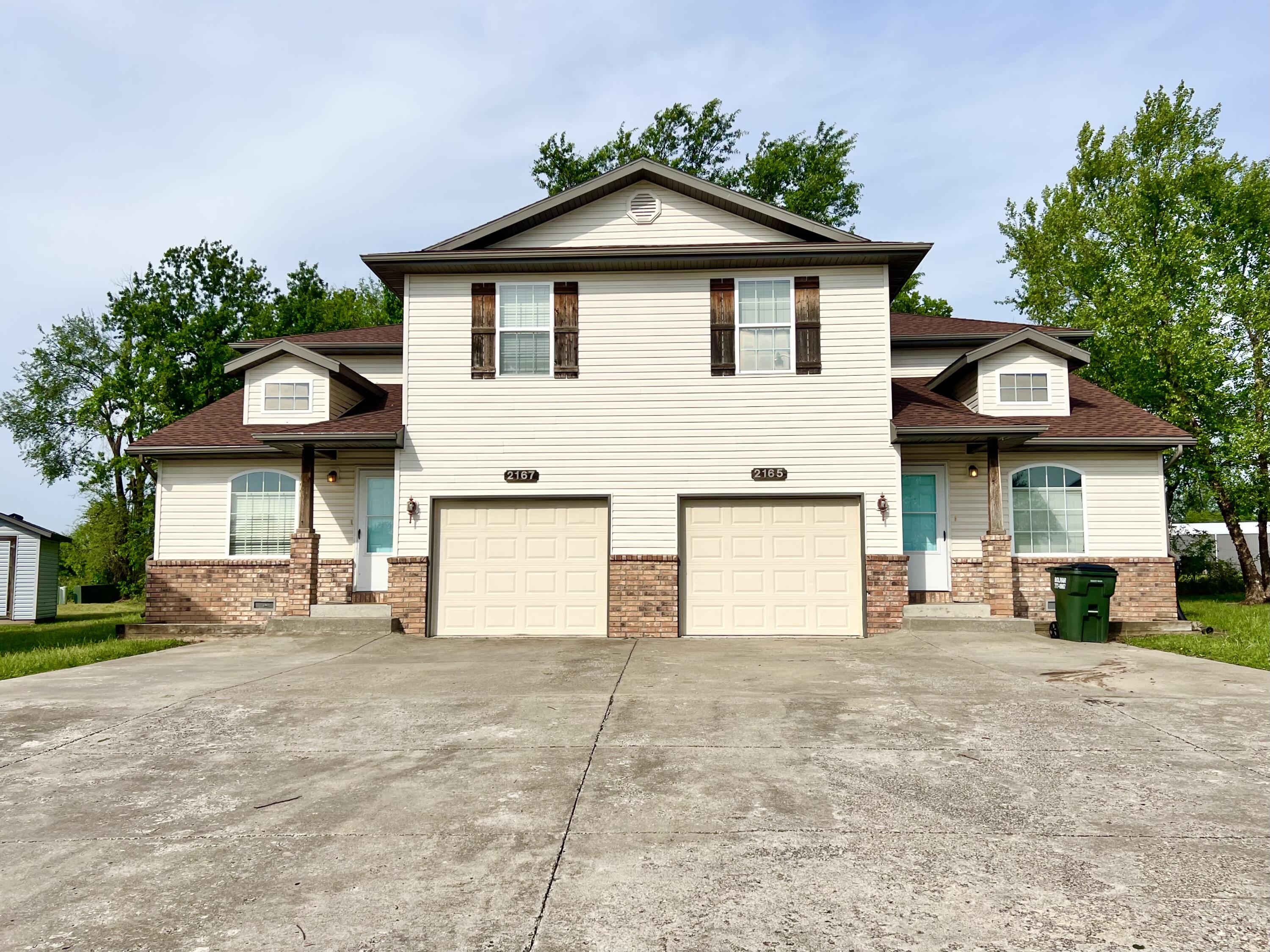 BACK ON THE MARKET- No fault of sellers or inspections!! Welcome to 2167 and 2165 Dogwood Circle centrally located in Bolivar Missouri. This property comprises two units, each with 3 bedrooms, 2 bathrooms, and a 1 car garage. Providing a total of 6 bedrooms, 4 bathrooms, and 2 garages.  As you step into each unit, you'll be greeted by a welcoming and bright living room. The kitchen and dining room are great in size, includes a pantry, and the sale will include all appliances in each unit. Both units feature upstairs a spacious master bedroom with an en-suite bathroom, as well as 2 additional bedrooms and a bathroom, providing ample space for family or guests. With its convenient location, close to the college and excellent income potential, this duplex is an excellent investment opportunity for investors or homeowners looking to diversify their portfolio. The backyard is perfect for outdoor entertaining, with enough room for barbecues, games, and relaxation. Do not miss out on this opportunity, schedule a viewing today! These units have tenants in them currently, please do not disturb. If interested in another duplex, please check out the listing 2125 and 2127 Dogwood, a few homes down!