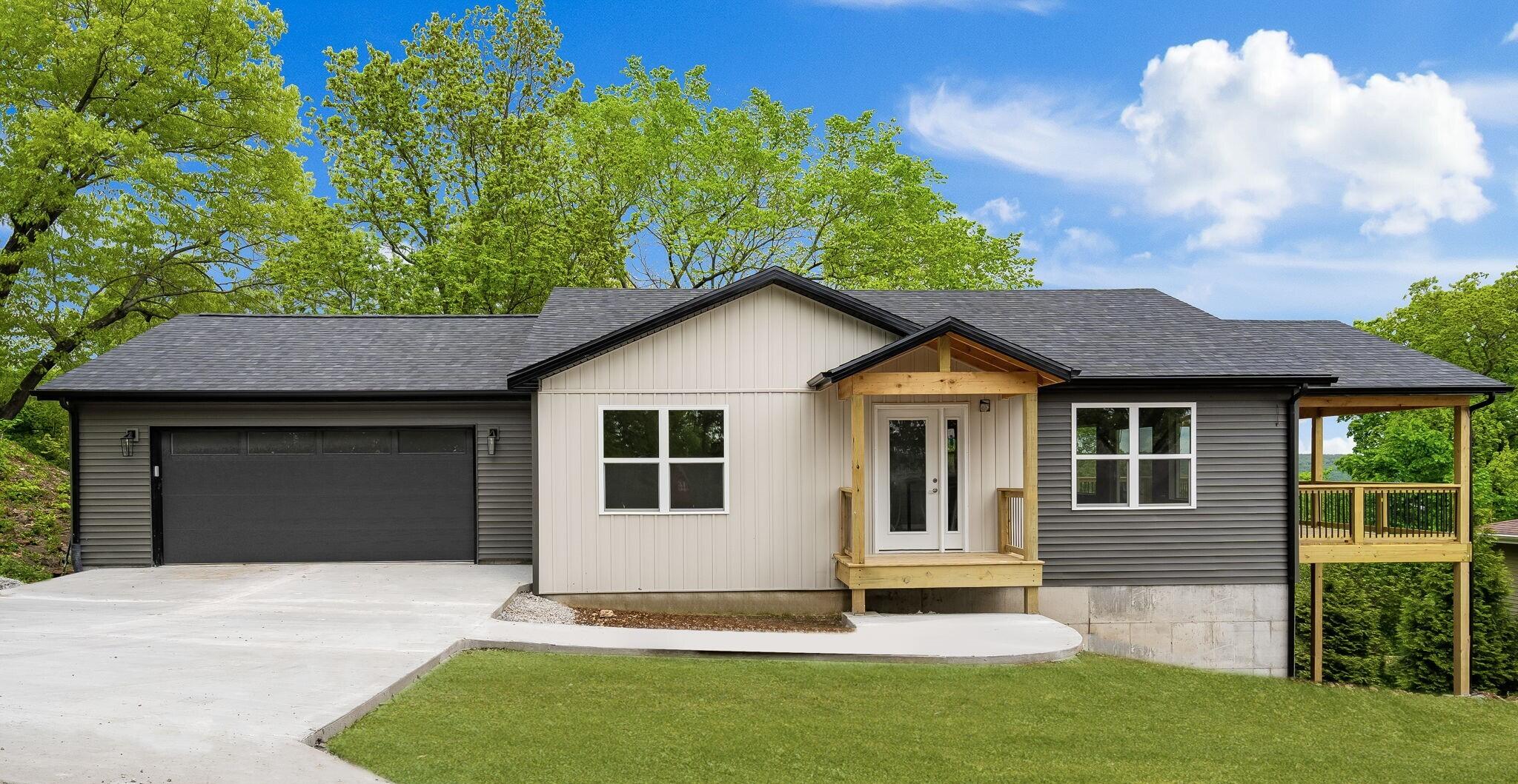 Brand new construction home in the heart of Kimberling City! Welcome home to Kimberling Hills Subdivision! Built by Skymarlan Builders, LLC. This beautiful open floor plan home boasts vaulted ceilings, 4 bedrooms, 2.5 baths, 2 living areas, 2 car garage, stainless steel appliances including a wine/beer fridge, granite countertops, an electric fireplace, Nest thermostat, and modern style lighting fixtures which makes this home bright and inviting., Relax and enjoy the BEAUTIFUL view of Table Rock Lake and the city from the wrap around partially covered deck under the breeze of an outdoor ceiling fan. This is the perfect home to enjoy your family either as your permanent home or just for a vacation home. This home is almost completed and will be move in ready within a couple of weeks! Call today to schedule your private showing!