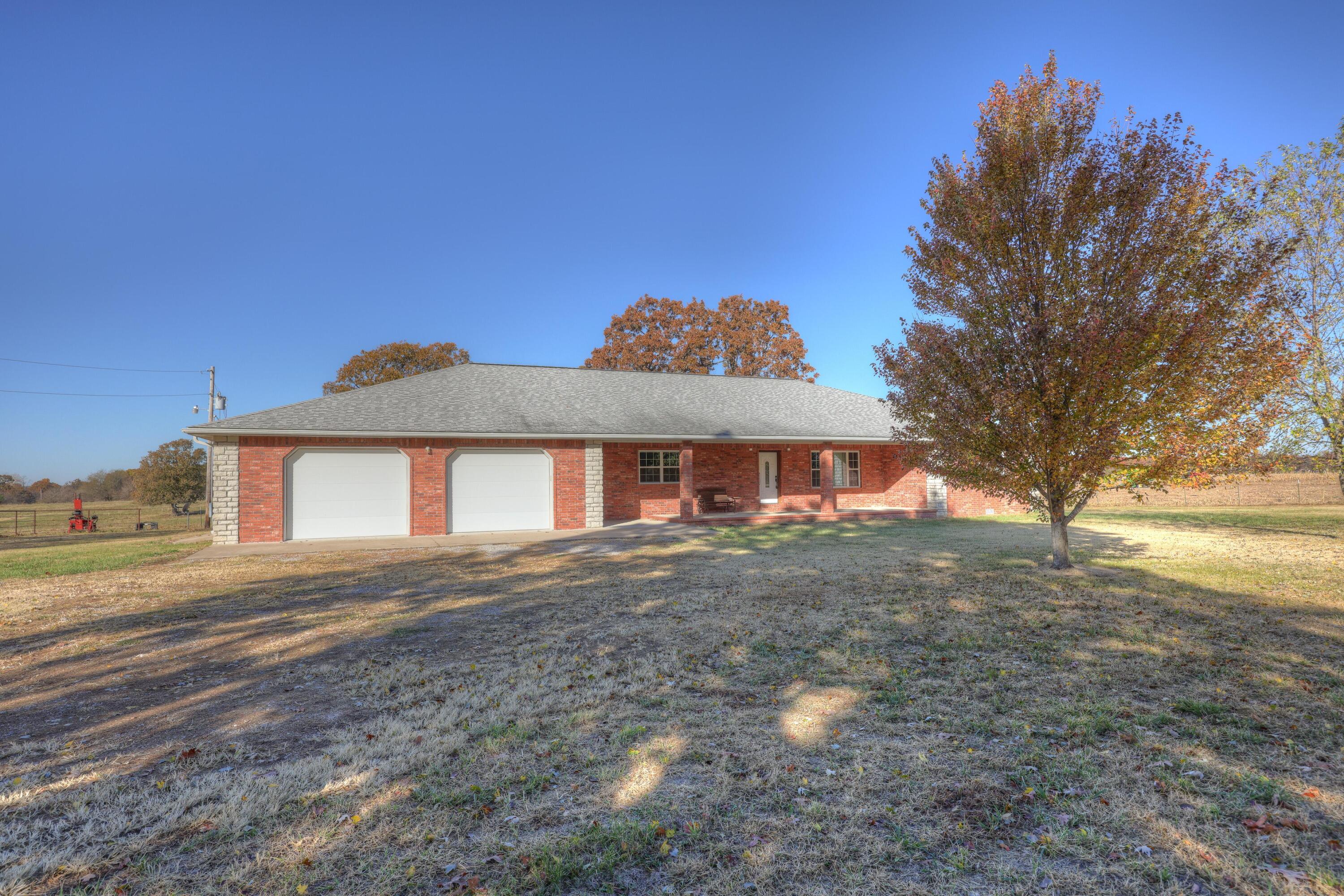 194 +/- acres, full brick home, 2 ponds and a spring, what more could you ask for? This gorgeous piece of land has road frontage on 3 sides, a corral setup that will convey and some cross fencing already in place. Per the seller, there is approximately 12 acres of woods and the remaining acreage is pasture, with most being tillable pasture, giving you the best of both worlds! Can't forget about the beautiful, all brick, 2400+ sqft, 4bdrm, 2.5 bath home, built in 2013! The all one level home features a spacious open living, dining & kitchen area, split bedroom plan with a huge & very private master suite! TONS of storage, a storm shelter, 3 car 32 x 37 attached garage with 10' doors!  This one was well built with R-40 insulation in the attic, plus 2 water heaters!  Enjoy your morning coffee, while sitting on the covered back patio, overlooking the amazing scenery all around. So many more great features that you will see in person, when you schedule your showing appointment!