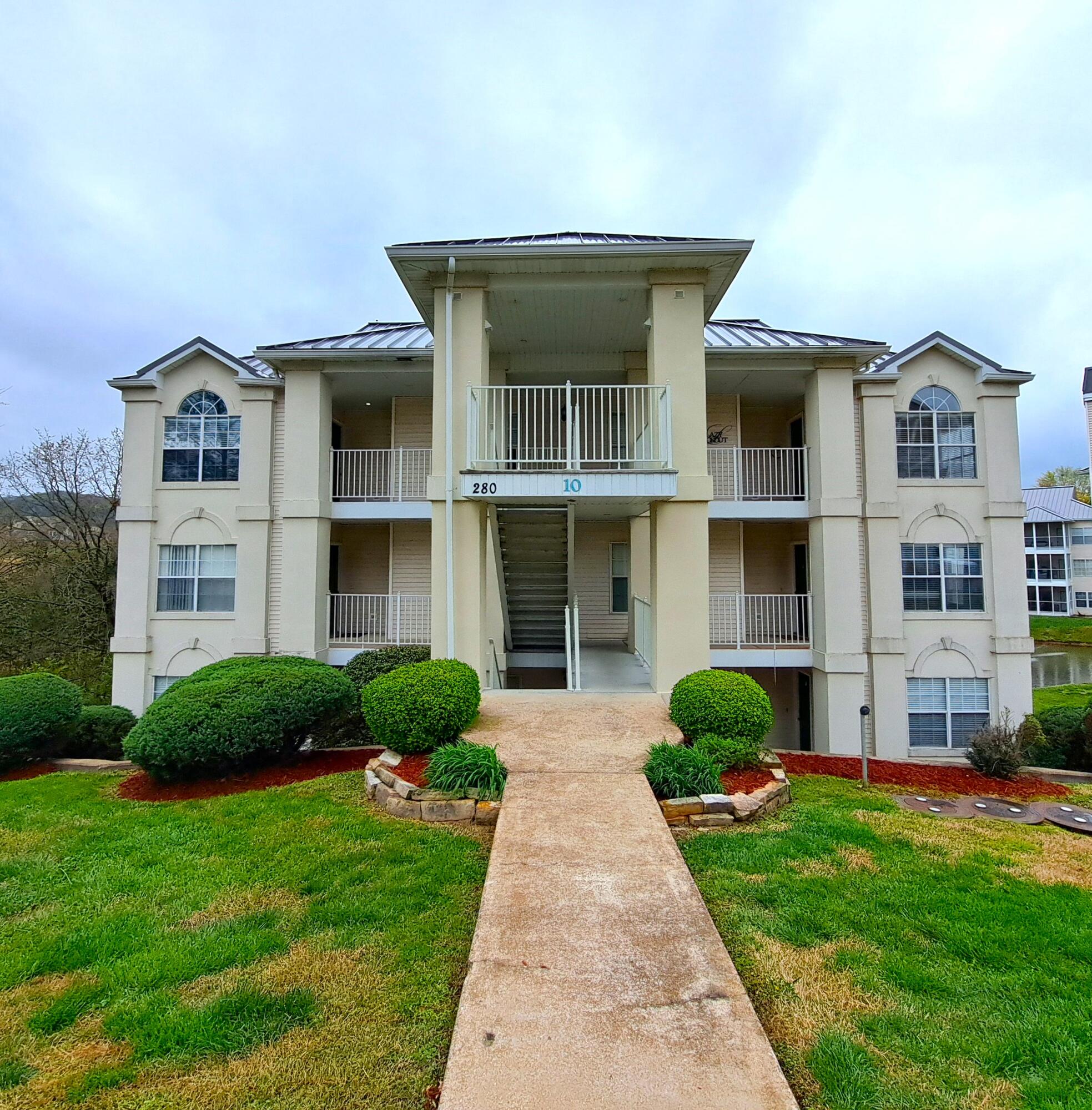 Imagine relaxing on your screened porch nestled among the trees, watching the birds and squirrels playing while listening to the relaxing water fountain and enjoying your morning coffee. This can be your reality as the proud new owner of this beautiful Branson condo. You will love the tranquility you find when you walk into this tastefully decorated and fully furnished condo after a busy day enjoying the shows, attractions and shopping in Branson. The open floorplan allows you to visit with your guests in the living and dining room, while in the kitchen. You will love the storage and recessed lighting throughout. Not many condos can offer a beautiful, hard-to-find custom tiled walk-in shower! The location is ideal, just a short drive to 76 and all Branson has to offer. You have to see the lovely decor, beautiful fireplace surround with marble insert, luxury vinyl plank flooring, crown molding and outside storage under the screened porch for yourself. Take a look at the other 2 bedroom 2 bath condos for sale in Branson, you will see that this one really stands out. Too many details to list. A single car garage a short distance away, with more storage is even included in the price, along with furniture, bedding, decor, cookware, utensils, dishes and glasses. Talk about move in ready! This condo has it all! This beautiful condo is an absolute gem, you really must see it for yourself!