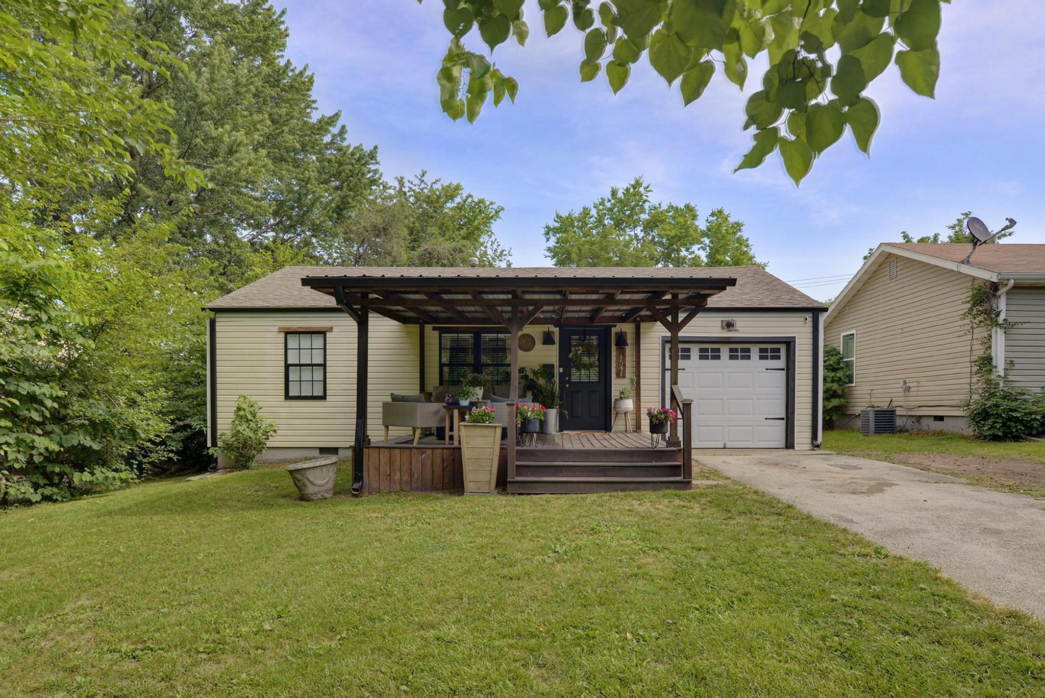 Hello Gorgeous!! This adorable home has been renovated from TOP to BOTTOM. As you walk up to the home, you are greeted by a large front deck perfect for entertaining or enjoying a cup of coffee in the morning. Step inside and check out the beautiful shiplap electric fireplace, sliding barn door, new laminate flooring, and fully renovated bathroom. This home has a kitchen straight from Pinterest! Farmhouse sink, open shelving, tile backsplash, and black accent lighting are just a few features that make this kitchen amazing. Step outside and enjoy a fully fenced in yard and covered back deck! Every inch of this home has been updated and is ready for its new owners. Come check it out, you will fall in LOVE with this perfect home.