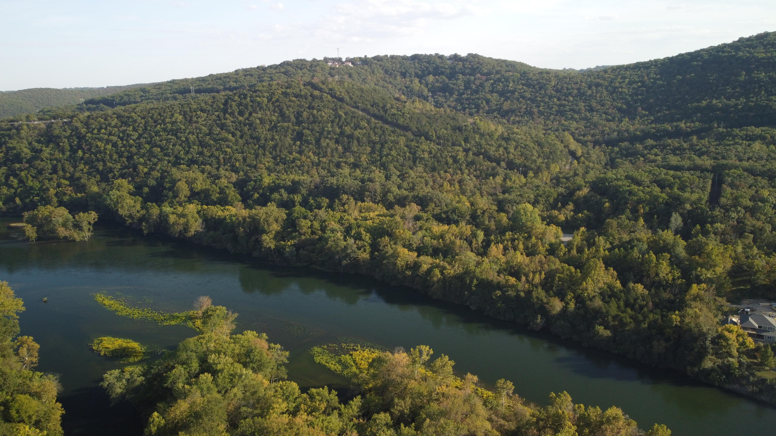 Prime development land for high density usage such as condo, time share, etc. Magnificent views of Table Rock Lake, Taneycomo and Table Rock Dam. Lake front on Taneycomo. Ready to be subdivided by aggressive developer. Additional 15 acres +/- available from related seller, see MLS 60224095.