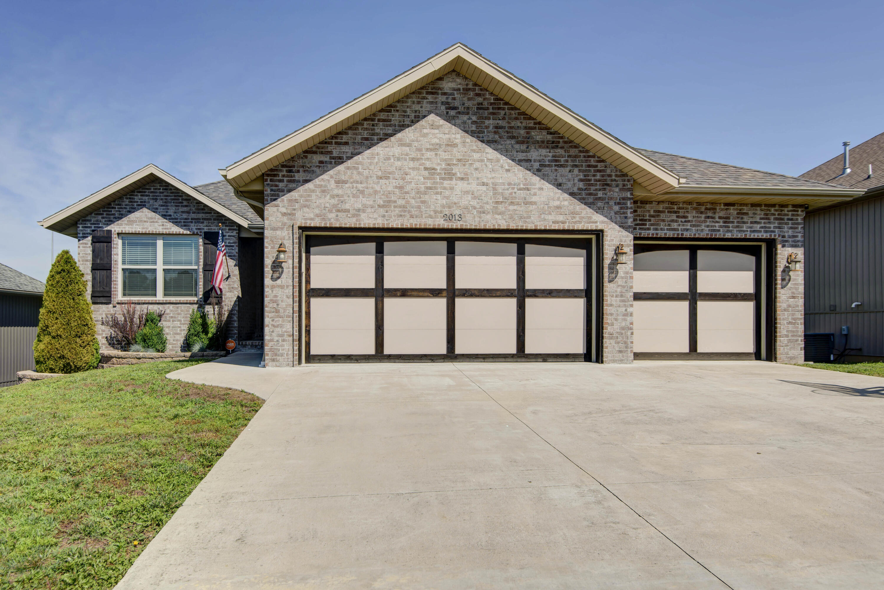 Back on the market with NO FAULT TO THE SELLER! This is your chance to check out this beautiful & immaculate home with MOTIVATED SELLERS! This five bedroom, three bathroom home in Ozark has everything you could want and more with many upgrades and 'extras' throughout. The main level features high ceilings and an open split bedroom floorplan. You will find beautiful cabinets and countertops in the kitchen with a large pantry and access to the covered deck. The primary bedroom suite features a large jetted tub and walk-in closet with built-in shelving. There are two more bedrooms and a full bath upstairs, as well as laundry and built-in mud room area. Downstairs features a large living room, two more bedrooms, a wet bar, storm shelter, and John Deere room. Outside, the backyard is its own paradise with a private hot tub (new in 2023), fire pit, TV area, and  a large fenced in yard backing up to open land.