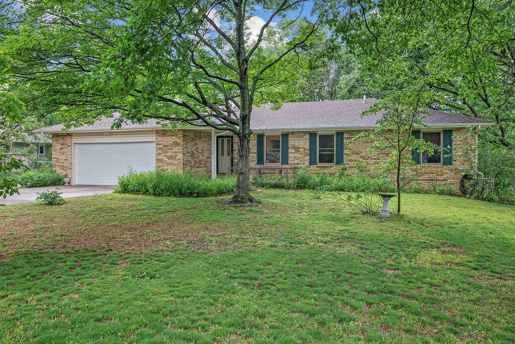 This lovely ranch style home is ready for you to move in and make your own! It boasts a new roof and gutter installed in 2022, so you can rest assured that it is in perfect condition. The neighborhood is beautiful and welcoming, with plenty of friendly neighbors who are sure to make you feel right at home. Enjoy the warmth and comfort of the fireplace on a cold winter night. Owner has several areas of natural grasses and plants.