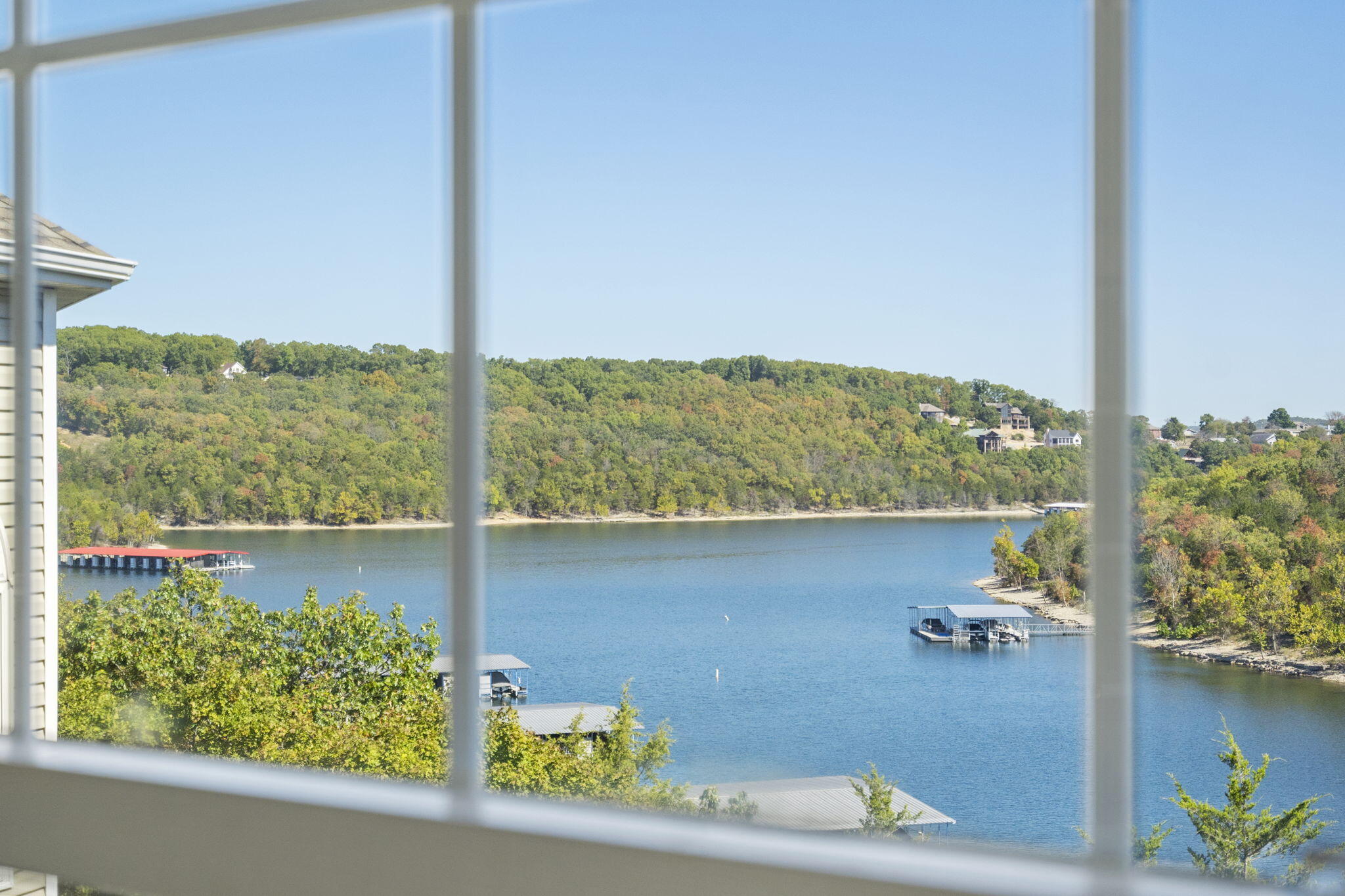 Experience lakefront living in this updated 3BR/3BA Ozark Mountain Resort penthouse condo at Table Rock Lake. Located in a desirable subdivision just south of the Kimberling City bridge, this spacious unit offers stunning views and convenient access to all amenities. Enjoy resort-style living with a community pool, boat launch, and proximity to the Port of Kimberling. Perfect for nightly rentals, with a lock-out unit. This is your chance to own a slice of paradise!  This unit has an upper bedroom suite, and screened deck.  Close to Silver Dollar City and all Branson attractions.  Possible  10x24 third party boat slip available for an additional $75,000 on Point 7.