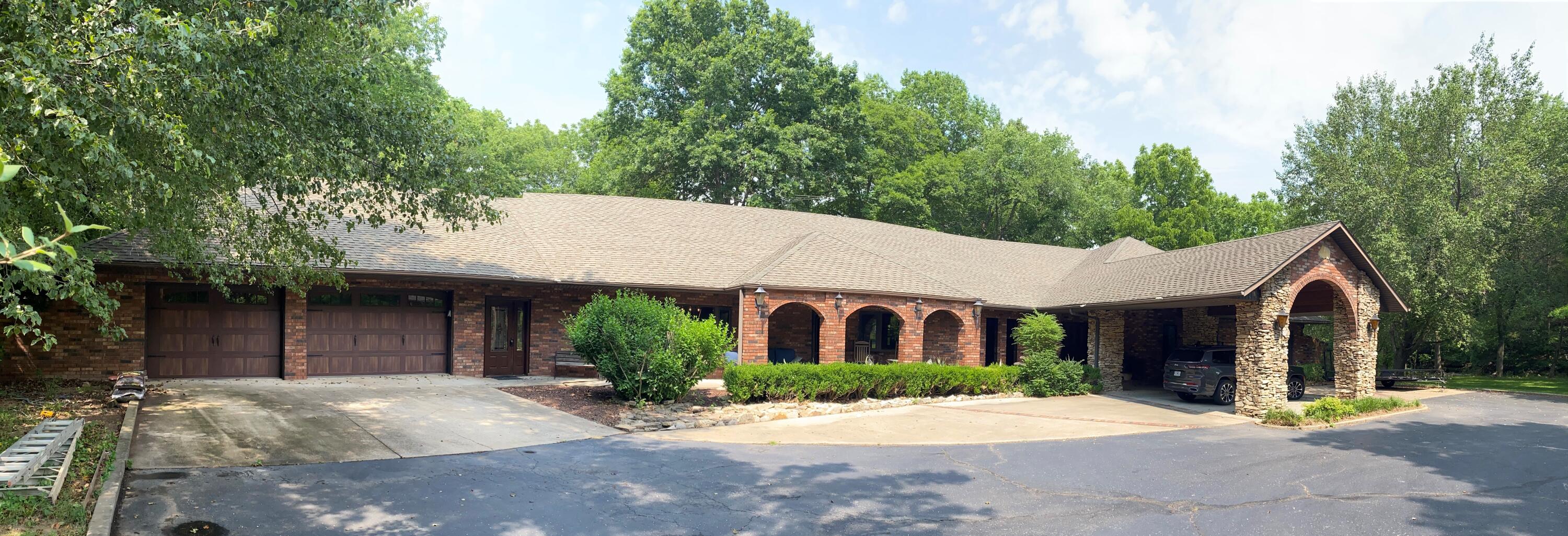 This beautiful , 4600 sq ft, all brick home is located on a  one of a kind, 1.97 acre lot, that has a parklike setting with mature trees, a babbling brook, and a flat yard. The home is all on one level and is on the market for the very first time. This home is quality constructed, as the builder built the home for his own family and has lived there for 30 years. The home features a large, open concept living area, 4 bedrooms, 4.5 baths, a large home office ( could be a 5th bedroom ), an amazing chef's kitchen ( the owner previously owned restaurants) a 900 sq ft garage plus a 1000 sq ft porte cochere. The home has many updates with a recent 50K kitchen update that includes a Wolf range, Bosch convection oven, Bosch steamer, Alto Sham prime rib oven, multiple sinks, pot filler, new granite and quality cabinets.  The home has top quality finish materials including beautiful granite, hardwoods, tile, oak trim, oak crown molding and more.. The home has high efficiency HVAC units, plus a ton of insulation that keeps the electric bills low. The home has a very quiet and private setting that feels like you are out in the country, but yet it is located very close to hwys 248 and 65.This is a very unique, one of a kind property!