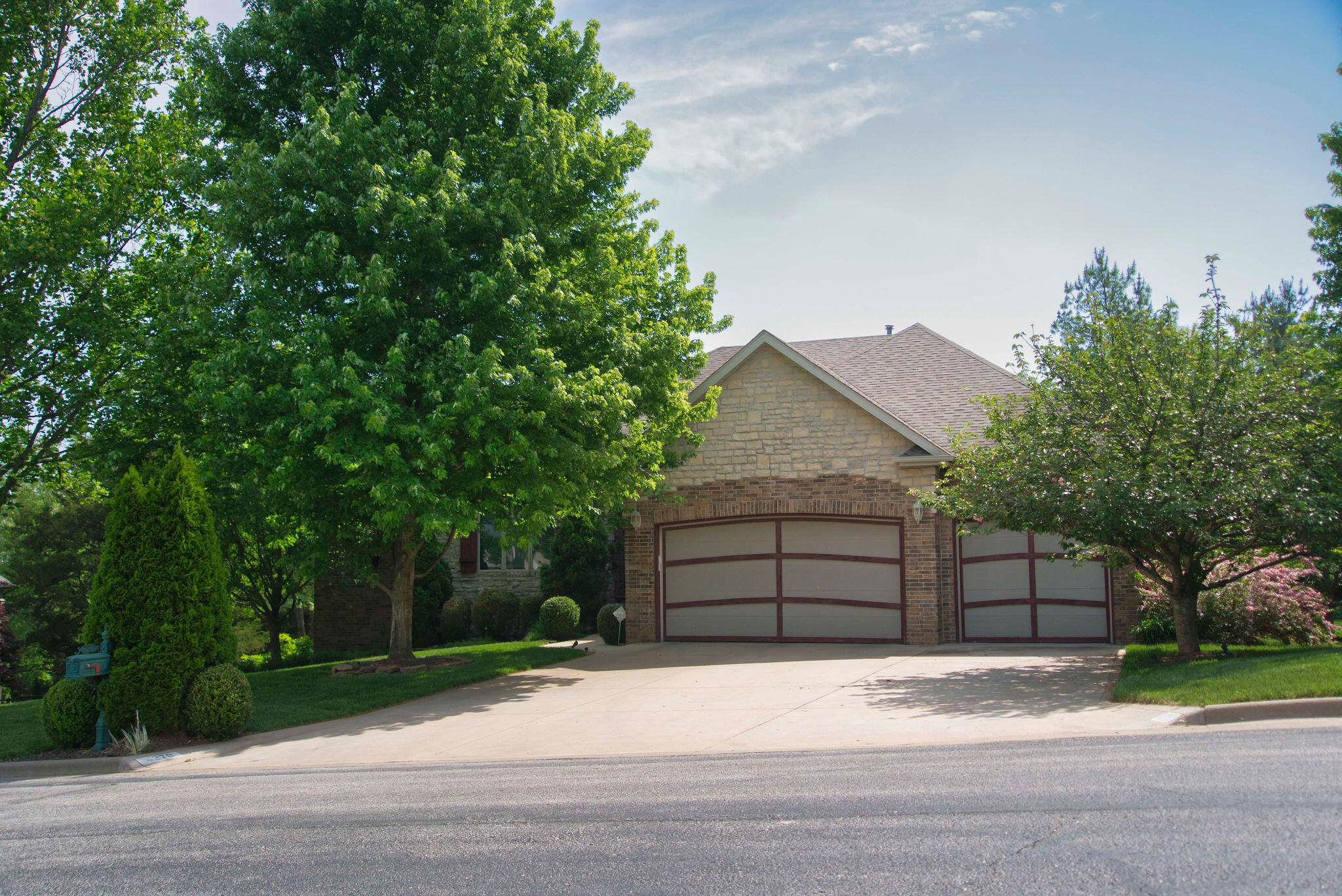 Stunning, modern/contemporary style, 5 bedroom home offering over 5546 sq ft that has been beautifully updated in Emerald Pointe subdivision. This all brick and stone walkout basement home is tucked back on a quiet cul-de-sac. The private backyard with heated inground pool offers the perfect place for entertaining or relaxing. Spacious open floor plan with vaulted, white beamed ceilings. All of the bedrooms are large. Floor to ceiling Anderson windows & doors in the living room, kitchen/dining & master bedroom. Gorgeous linear design fireplaces upstairs and down. Big living room. The kitchen was completely gutted & remodelled in 2014 with all new custom cabinetry w/pullouts, high end Silestone quartz countertops, big walk-in pantry, Jenn Air appliances, including commercial size fridge. (Master suite and basement was remodelled in 2014 as well) There are two bedrooms on the main level. The master suite is huge, with enough space for a sitting area. The master bath has been updated as well. Glass railing leading to the basement where you will find another large living/family/rec room with wet bar, three additional bedrooms and a bonus/workout room. Large storage closets, Central vac, security cameras, central stereo in rooms, water softener. The three car garage has a separate workshop & wired for electric car charger. The38 X 16 ft (8ft deep) pool comes w/a diving board and auto-cover. There is an outdoor shower, sound system & landscape lighting. Great outdoor living space upstairs and down. The deck is TimberTech brand with aluminum railing. Aluminum fence in the backyard. Screen in patio just off the pool w/ tiled flooring, fan/lights. New roof in 2020, zoned hvac, 400 amp electrical. This home has so much to offer!