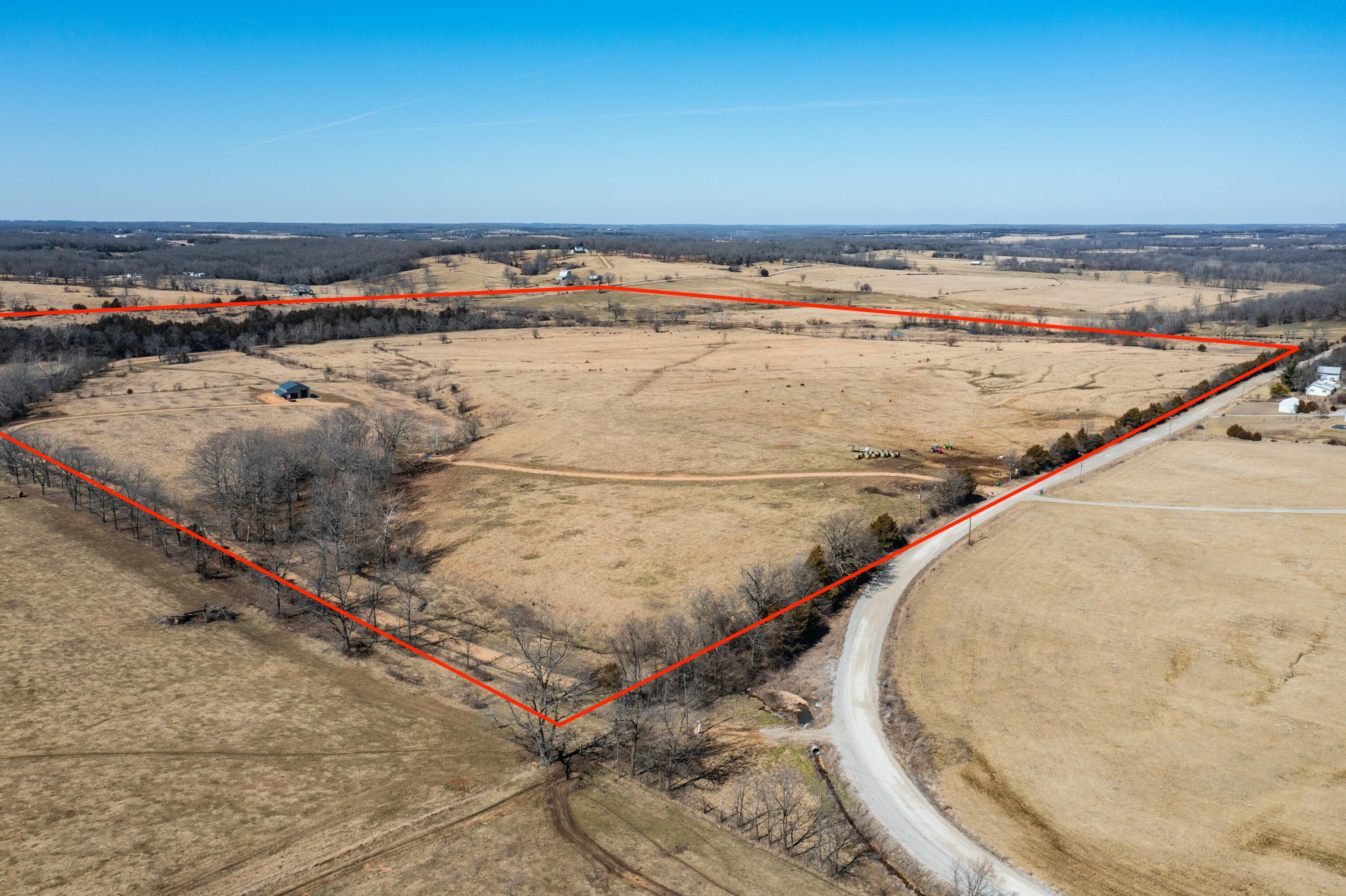 Beautiful 160ac of Missouri Paradise with New! Shop and 3/4mi of the West Fork of the Niangua River rolling thru it! Black Horse Ranch is located in Webster Co. Missouri and situated only 2miles west I-44 at Exit 107. The property is fenced, cross fenced and offers a newly constructed 48x36 shop, with 16ft sidewalls and a 9ft leanto. Shop door openings are 12x14 & 12x10 and are ready for garage doors. Complete this shop to your own liking! The farm can be accessed from 2 sides; Long State Hwy Y to the west and Black Horse Rd. to the east.  A lower road has been started just to the south of the property, giving a second access off of Black Horse. The naturally beautiful and sparkling waters of the West Fork of the Niangua River runs through this property and offers live water, year round. Spending summers on your own gravel bar with friends & family will become one of your favorite pastimes! The ideal property you've been dreaming of where farming, recreation & relaxation can be found! Call us today for your private tour!