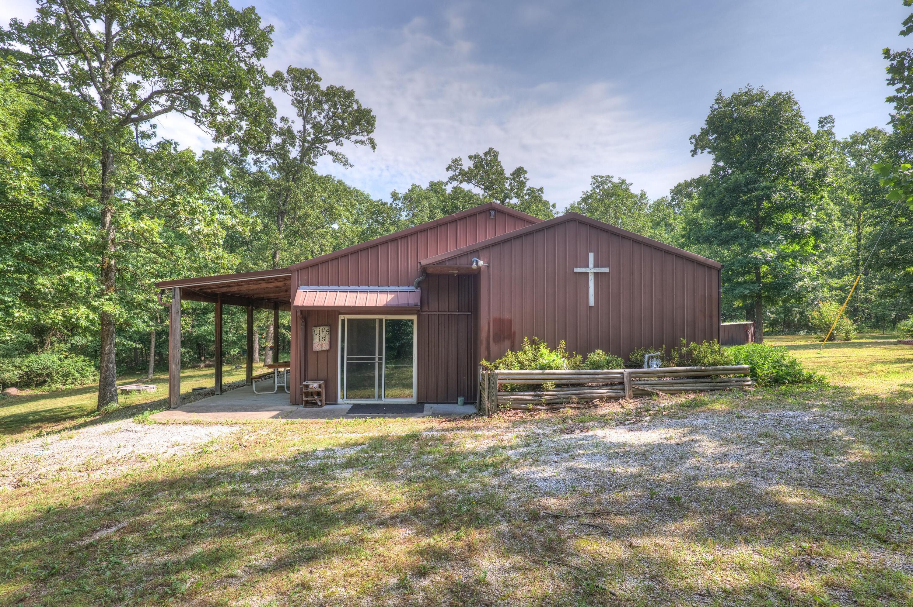 Amazing retreat on almost 20 acres! Step into your own private oasis located right between Joplin and NWA! The home features a wide open floor plan with floor to ceiling pine shiplap, painted concrete floors, a cozy wood stove, stainless appliances, and plenty of room for all your gatherings. Wildlife is plentiful, and so is the peace and quiet. Hang out by the firepit or take a stroll through the woods. Call today for a personal tour!