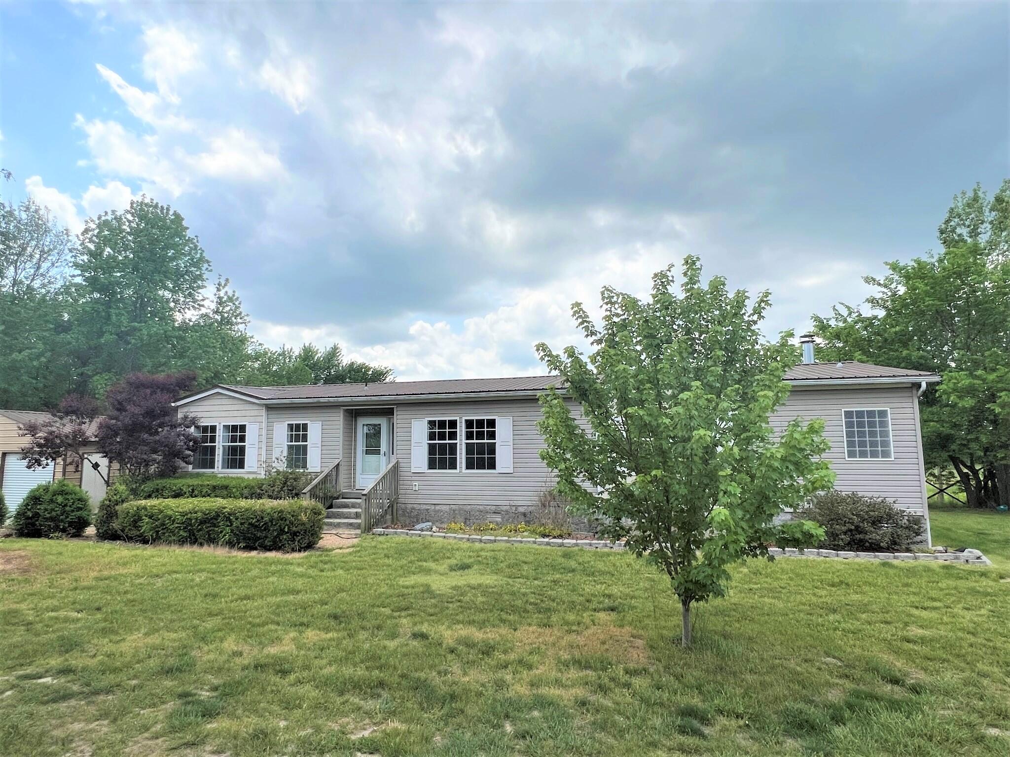 Country Living close to Springfield.  Almost 11 ac m/l of fenced horse land or any animal you choose.  Beautiful newly remodeled home has 2 Living areas, beautiful kitchen, large bedrooms, big utility room, large, covered deck, a 16 x 32 garage/shop, a 60 x 36 barn, 2 ponds and a storm shelter that can fit up to 8 people.  Be sure to check out all the pictures and call to view today.  This property is South of Buffalo and an easy drive to work in Springfield.