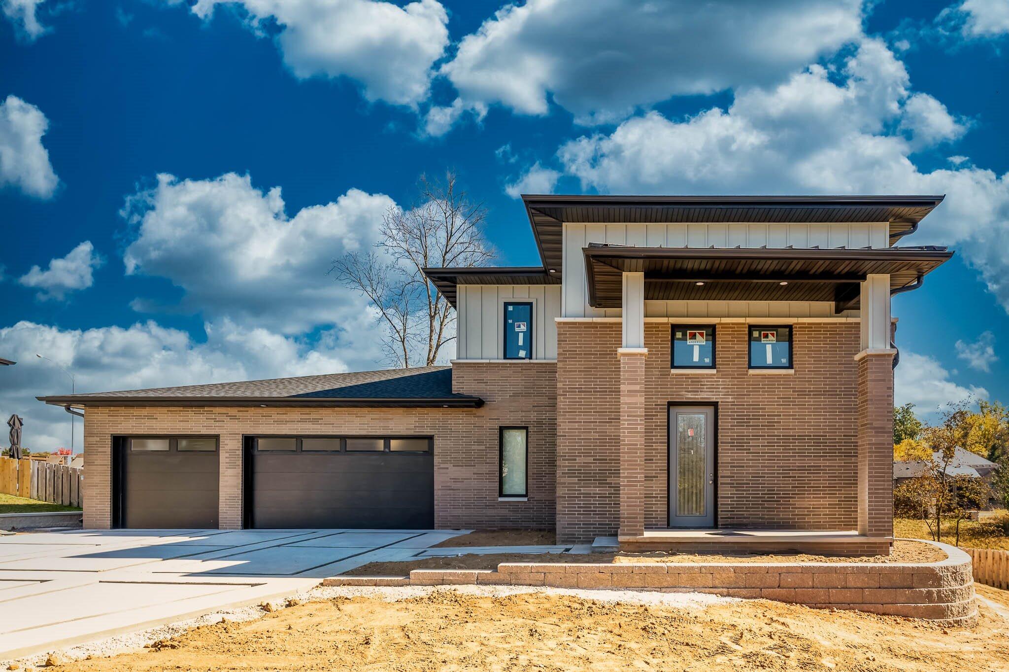 This new construction home in Anthony Park is a must see! Step inside to soaring ceilings and an open floor plan. White oak cabinetry and flooring flows throughout the entire home. The custom kitchen is a dream with GE Cafe appliances, open corner shelving, a wine cooler and massive pantry with space for an additional refrigerator or freezer. The space opens to the spacious living room with a floor to ceiling double sided fireplace. The primary bedroom suite is the only bedroom on the main floor. Here you'll find an oversized walk-in closet with custom cabinetry and shelving that connects with the laundr room. The laundry space also houses custom cabinetry, a linen pantry, sink and hamper storage. Relax after a long day in the free standing tub or the walk in shower with glass enclosure. The bathroom space was designed to meet all of your needs with two vanities, one with a makeup vanity extension with a backlit mirror. Entertain with ease in the outdoor kitchen featuring an outdoor refrigerator, Summerset stainless gas grill, 72'' fan, 5' stainless vent hood and a TV box space. Upstairs you'll find a second living area an 3 additional bedrooms, an additional washer/dryer set up, a Jack & Jill bath and one private bathroom. This property has been built with every detail hand picked by the builder with quality and style in mind.