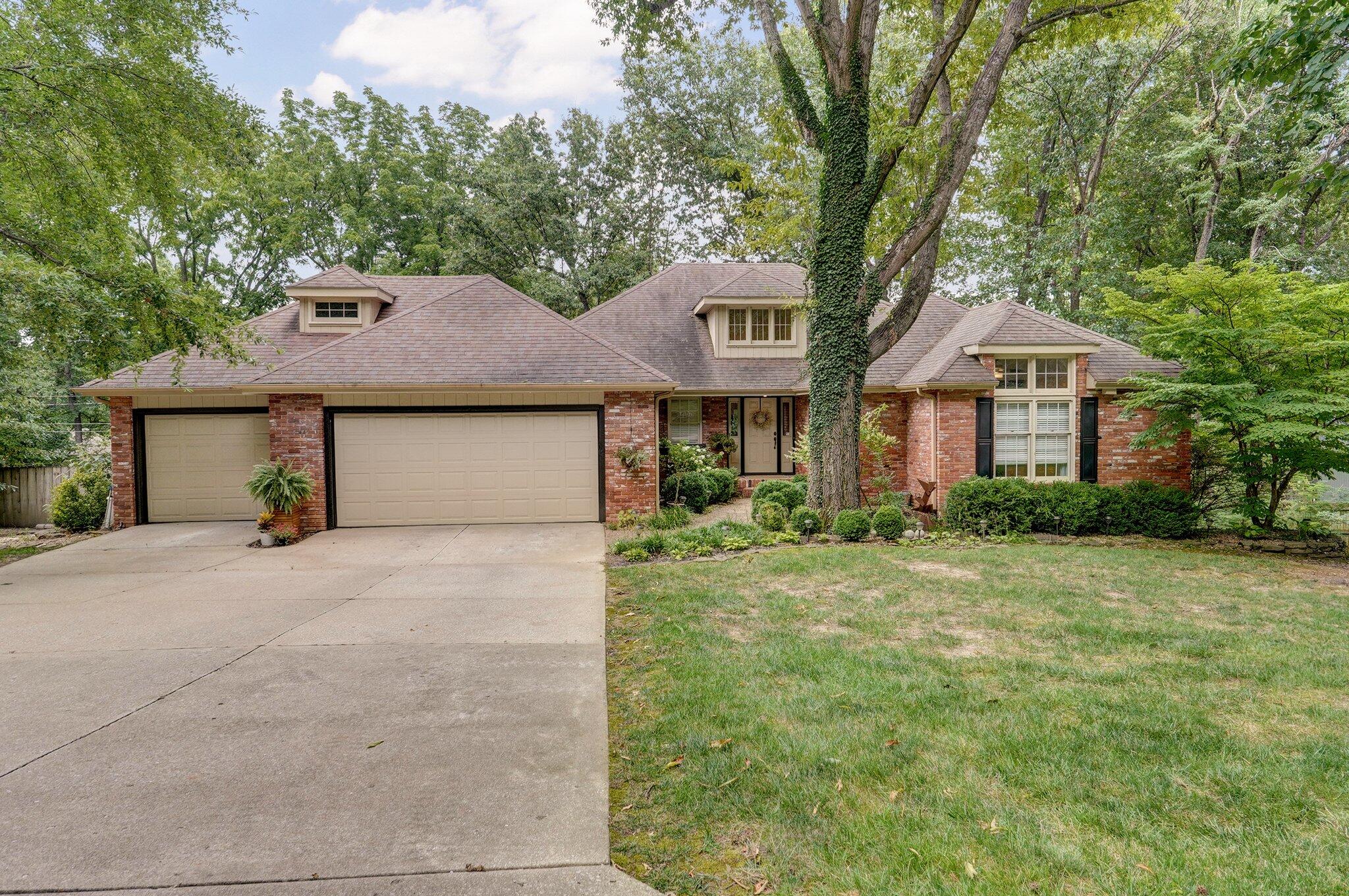 Classic home nestled in Springfield's beloved Oak Knolls subdivision, known for its mature trees and distinctive character. Situated on a quiet cul-de-sac, this residence offers convenient access to shopping and restaurants as well as easy access to 65 Bypass for easy access to all of Springfield. Updated with care, the home features high ceilings, a formal living room with a gas fireplace, a gracious dining room, and an expansive eat-in kitchen. The kitchen boasts granite countertops, custom cabinets, a gas stove, double ovens, refrigerator, and a charming coffee nook/wine bar. Additional living spaces upstairs include a sunroom and a delightful screened-in porch, perfect for enjoying the outdoors in comfort. The main level also includes a spacious primary ensuite, a secondary bedroom and bath, and a convenient laundry room. Downstairs, the basement offers a large family room with a gas fireplace and a pool table. Three additional bedrooms and two full baths provide ample space, along with a versatile room ideal for an office, home school room, playroom, craft room, or exercise area.The downstairs sunroom with a wet bar is a convenient space to hang out between the house and pool. A spacious three-car garage and well-maintained landscaping complete this inviting property. Perfect for entertaining, the home offers diverse spaces that cater to every need, ensuring memorable gatherings for friends and family alike. Whether grilling on the screened-in porch or enjoying leisurely afternoons by the pool, this home promises a lifestyle of comfort and enjoyment.Don't miss out on this exceptional opportunity to own a home in one of Springfield's most desirable neighborhoods, with easy access to dining, shopping, and all the amenities of city life from the outskirts of town.