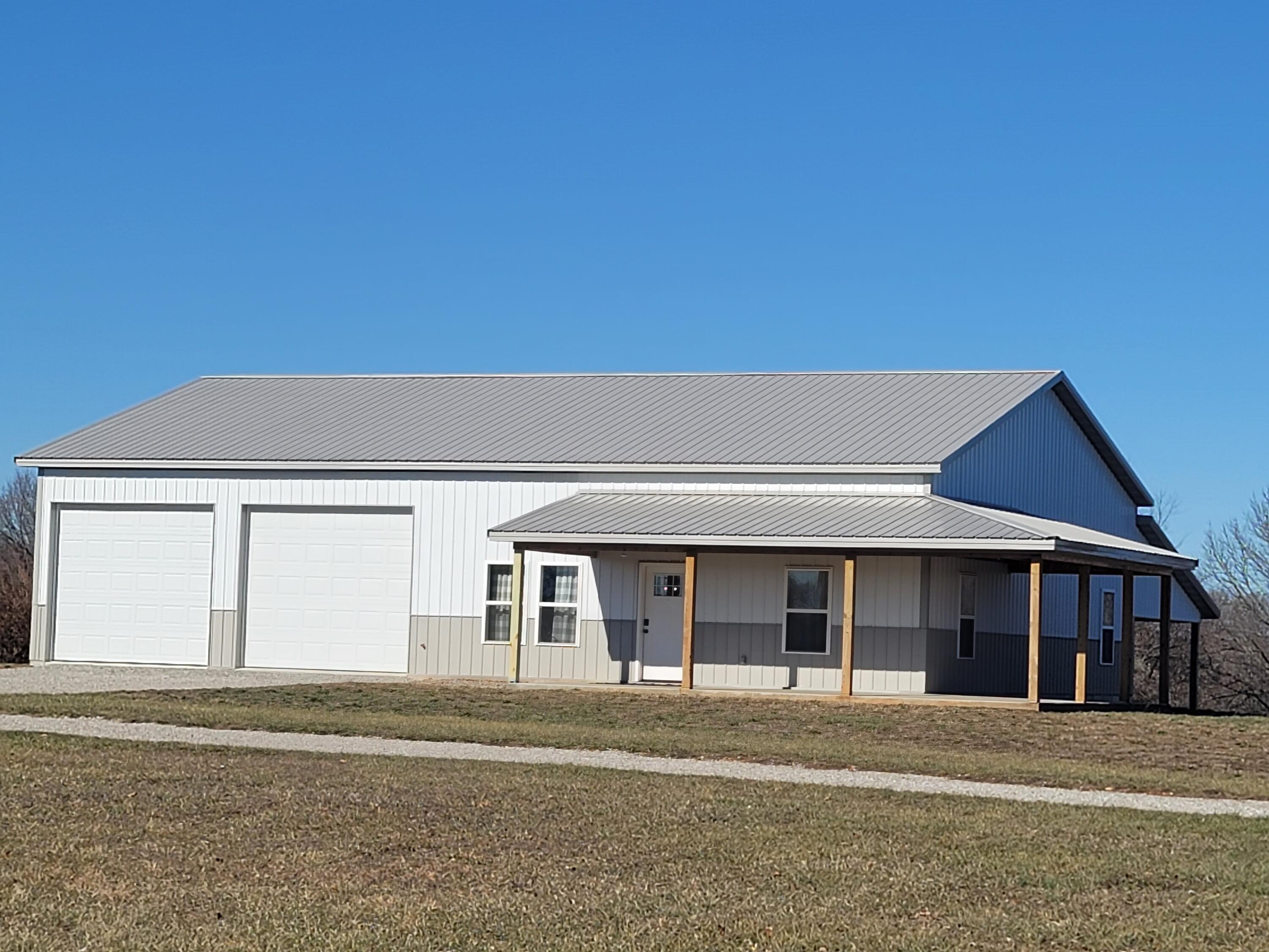 Newly constructed 2 -3 bedroom 1.5 bath home on 3.58 acres m/l.  Peaceful Country Living in this gorgeous home.  1200 sq. ft home plus 1200 sq. ft. garage/shop. Large pantry could be used for a small bedroom or office, it does not have a closet. Great open floor plan.  The home and garage are heavily insulated with spray foam insulation, heavy steel fencing with gate, covered front and side porch to enjoy the scenery, large covered back for storing or great spot to concrete a nice patio for entertaining. Just feels like home!