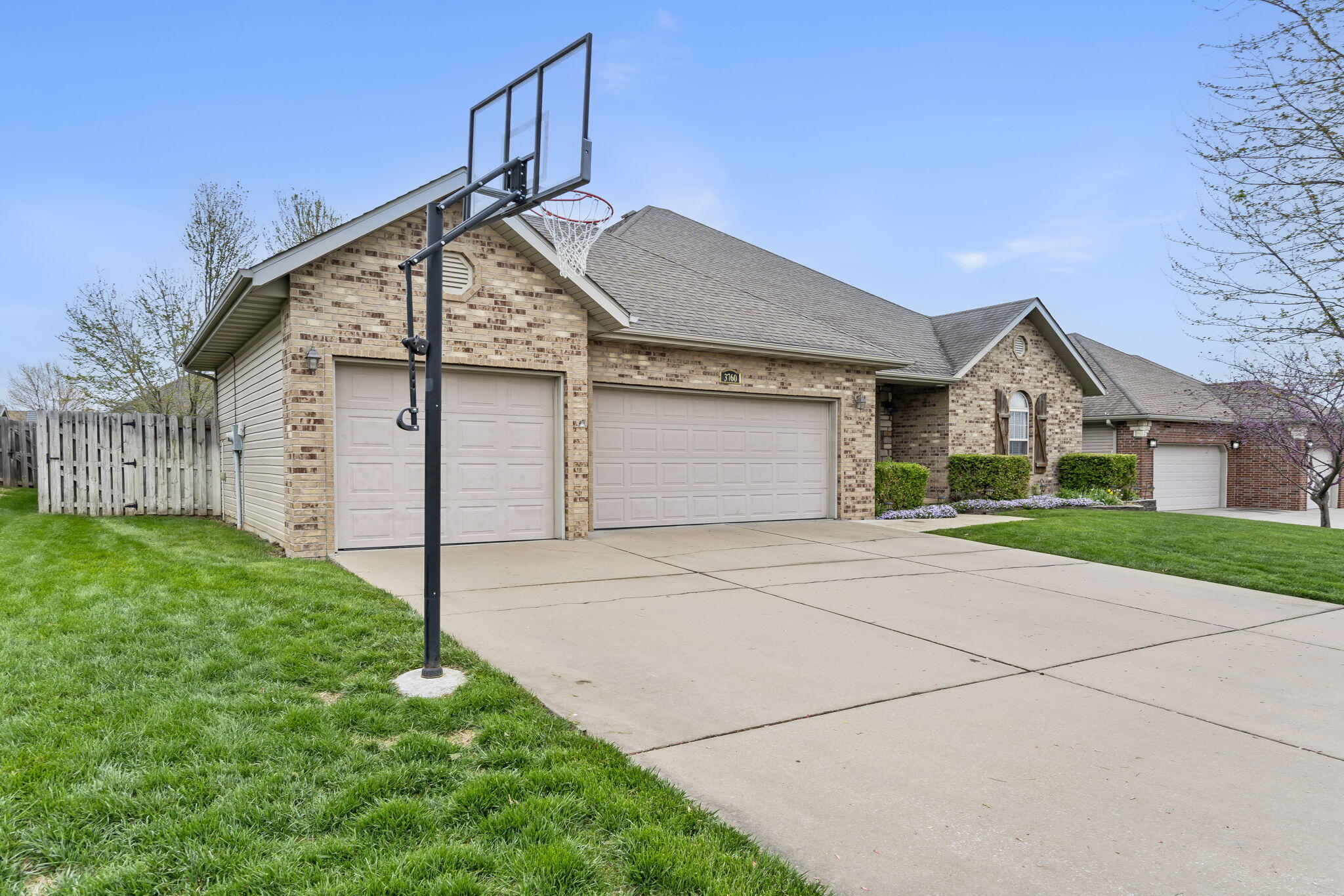 Welcome to the subdivision of Huntington Park where you will find this one level home located on a dead-end-street. Curb appeal is top notch as the lawn and landscaping has been routinely serviced by Ryan Lawn and Care since ownership in 2017. Home is accompanied with a sprinkler system located in the front and back and is wired for fiber-optic. Through the front door you're greeted with high ceilings, multi-view see-thru fireplace, and an abundance of lighting. Kitchen area boasts laminate countertops, stainless steel appliances, plenty of wooden cabinetry, an eat-in kitchen with breakfast bar, and bonus room located off the dining room area. All home appliances including refrigerator and washer / dryer all come with the purchase price of the home. Huge primary bedroom and bathroom lead to his/her sinks, walk in closet, and your own built in gun safe. Additional rooms are all different in sizes making it accommodating for your needs. The fully fenced in backyard area gives way to your own covered deck area, fire pit, and storage shed. Seller is providing a transferable HSA home warranty that runs through February of 2025. Home is conveniently located 2 minutes from Hillcrest High School, 5 minutes from the Dickerson Park Zoo & Ozark Empire Fairgrounds, and 18 minutes from Fellows Lake. Call your agent to schedule your showing today!