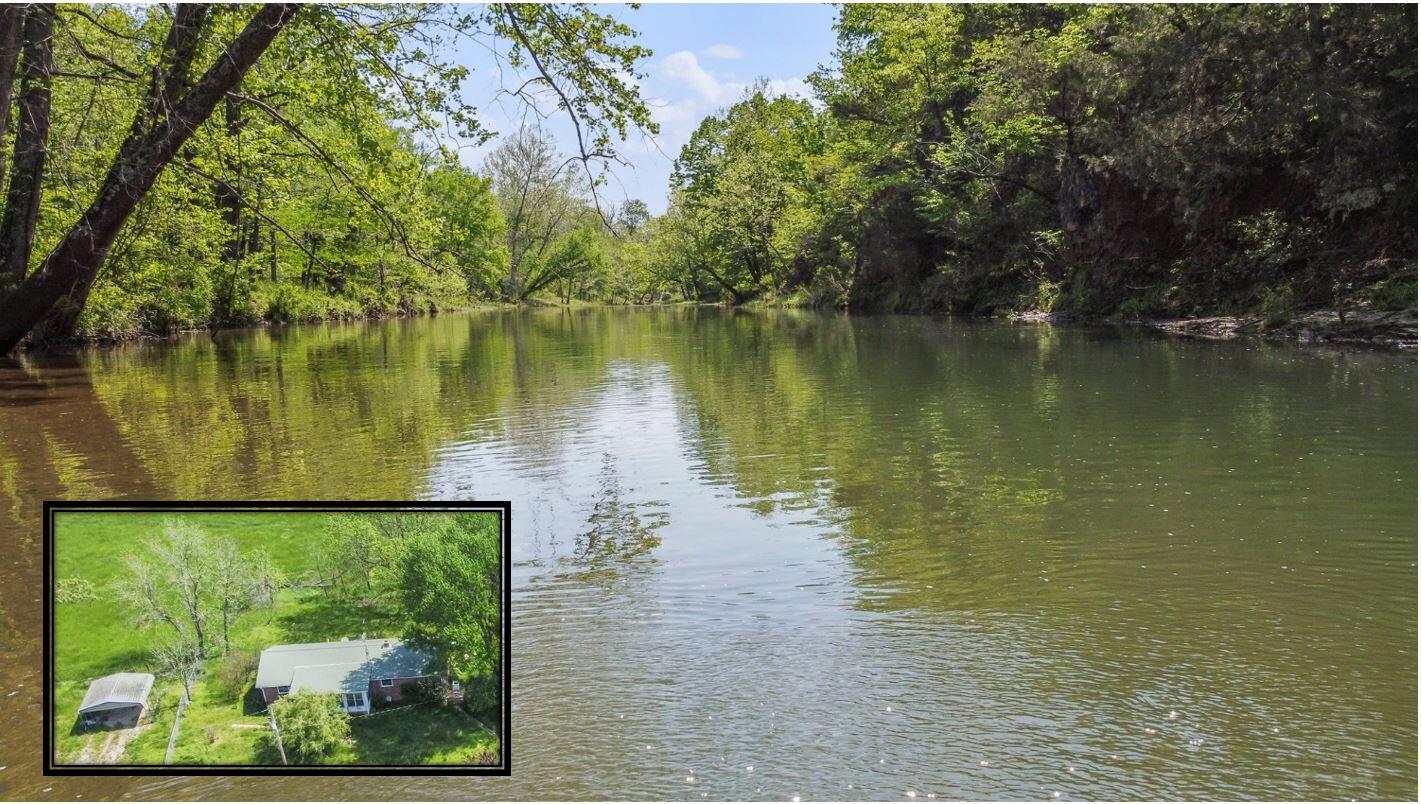 Missouri Cattle Farm with Beautiful Spring-Fed, Year-round Creek and Nice Ranch Style Home, Large Barn with upper and lower ground level entry, a Chicken Coop and Several more Outbuildings located at the edge of West Plains Mo in Howell County.  This is one nice Southern Missouri Farm with Lush Hay Fields - Last year they cut 141 Round Bales.  The property is fenced and cross fenced, ponds and good mix of Mature Timber.  Ground lays nice with some excellent valley ground for hayfields and the Spring Fed Creek is so Beautiful.   The comfortable ranch style home has 3 bedrooms and 2 baths, country kitchen with breakfast bar, living room and sunroom overlooking the farm!  You could be self-sufficient with established garden area, fruit trees and year round live water!  Farm is set up for Rotational Grazing.  Fenced in yard. Several of the shop/outbuildings have electric, and there is frost free hydrant water.   There is an eagle's nest and abundance of wildlife.  Several beautiful building sites to expand for family!