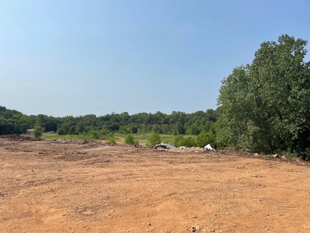 Property was formerly a Quarry, then an Auto Salvage Yard.  Business is receiving 'clean' fill, being used to increase height of grade above flood plain areas.Existing business could be included with purchase of land and structures.  Public sewer is along portion or West Property Line.There is a two story, 4,000 sq. ft. office / warehouse and other shop buildings.