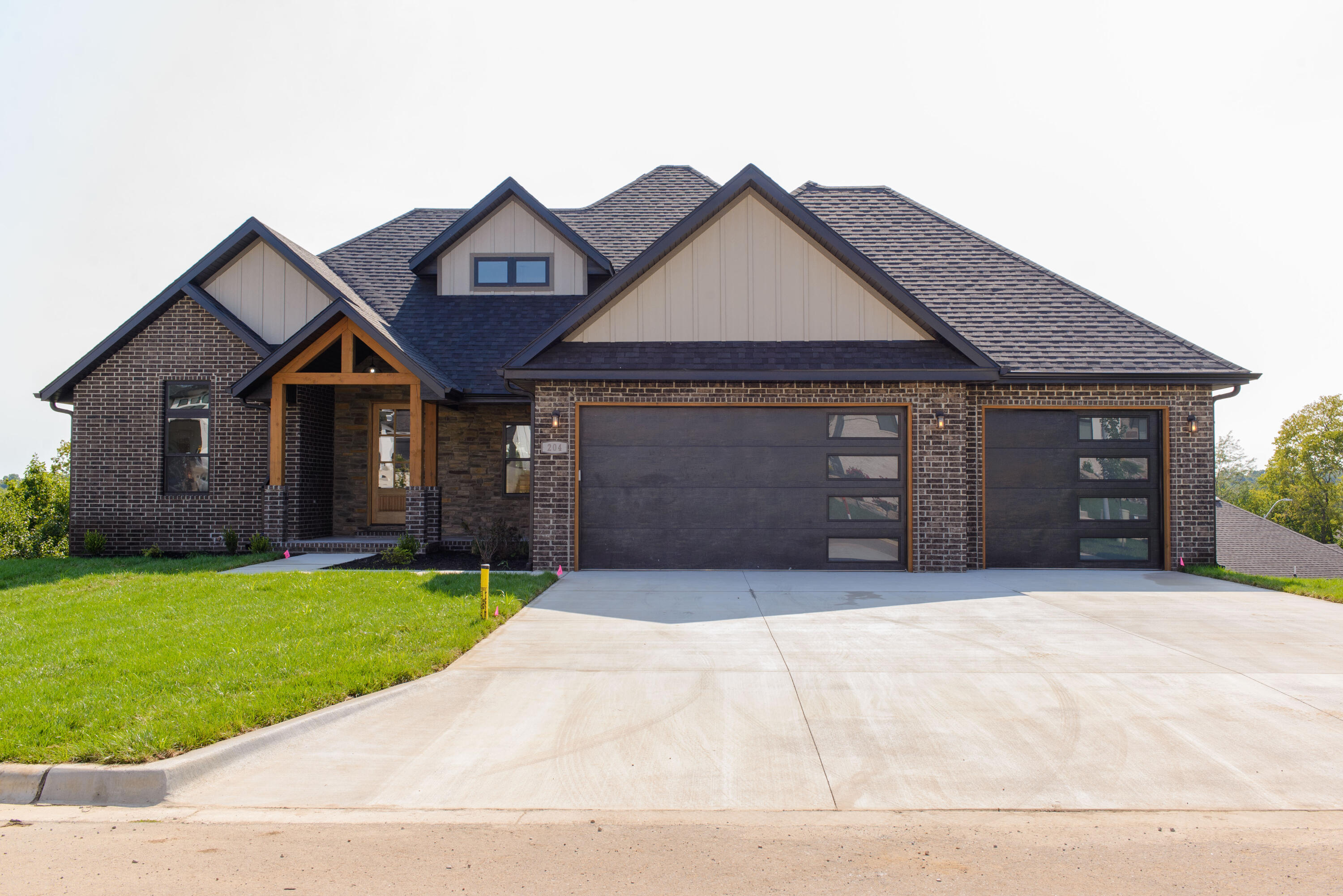A beautiful 5 bedroom and 3.5 bathroom walkout basement. Cathedral ceiling in living room.  Beam work throughout the main living area.  Floor to ceiling kitchen cabinets.  Two sprawling living areas.   Exterior storage room in basement.  Flex room in basement.  Tons of storage.  This house plan is one of a kind and a must see!