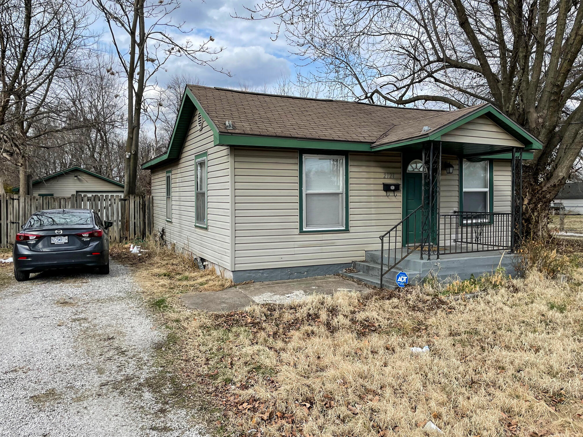 Great starter home or investment opportunity in this 2 bedroom home.  You will love the backyard and garage/shop building with electricity.  The home has hardwood floors and a master suite with entry to the bathroom(the bathroom also has a 2nd entrance from the laundry room).  The washer, dryer, and fridge are also included!  Look at the pantry space with hinged shelves and a cutting board!  You can enjoy the outdoors on your deck overlooking the shadow box, privacy fenced yard.  The shop building has plenty of outlets and shelving for the hobbyist.