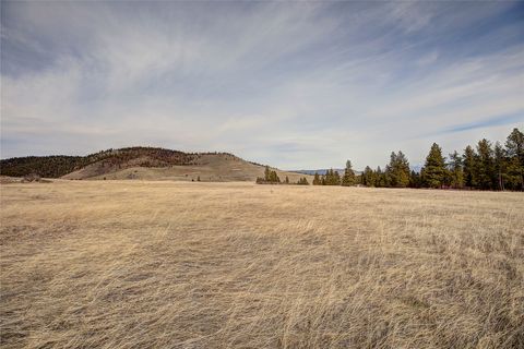 Photo of 31365 Walking Horse Lane, Big Arm, MT 59910 (MLS # 30066386)