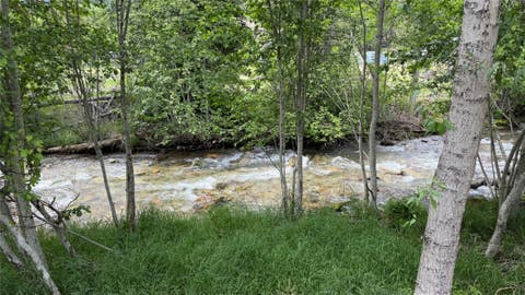 Tiny photo for 5671 Kootenai River Road, Libby, MT 59923 (MLS # 30072280)