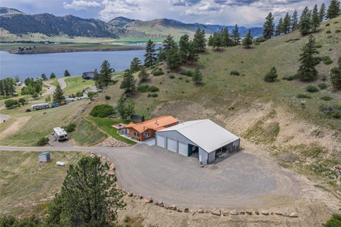 Photo of 2792 Mountain Lion Gulch, Wolf Creek, MT 59648 (MLS # 30073892)