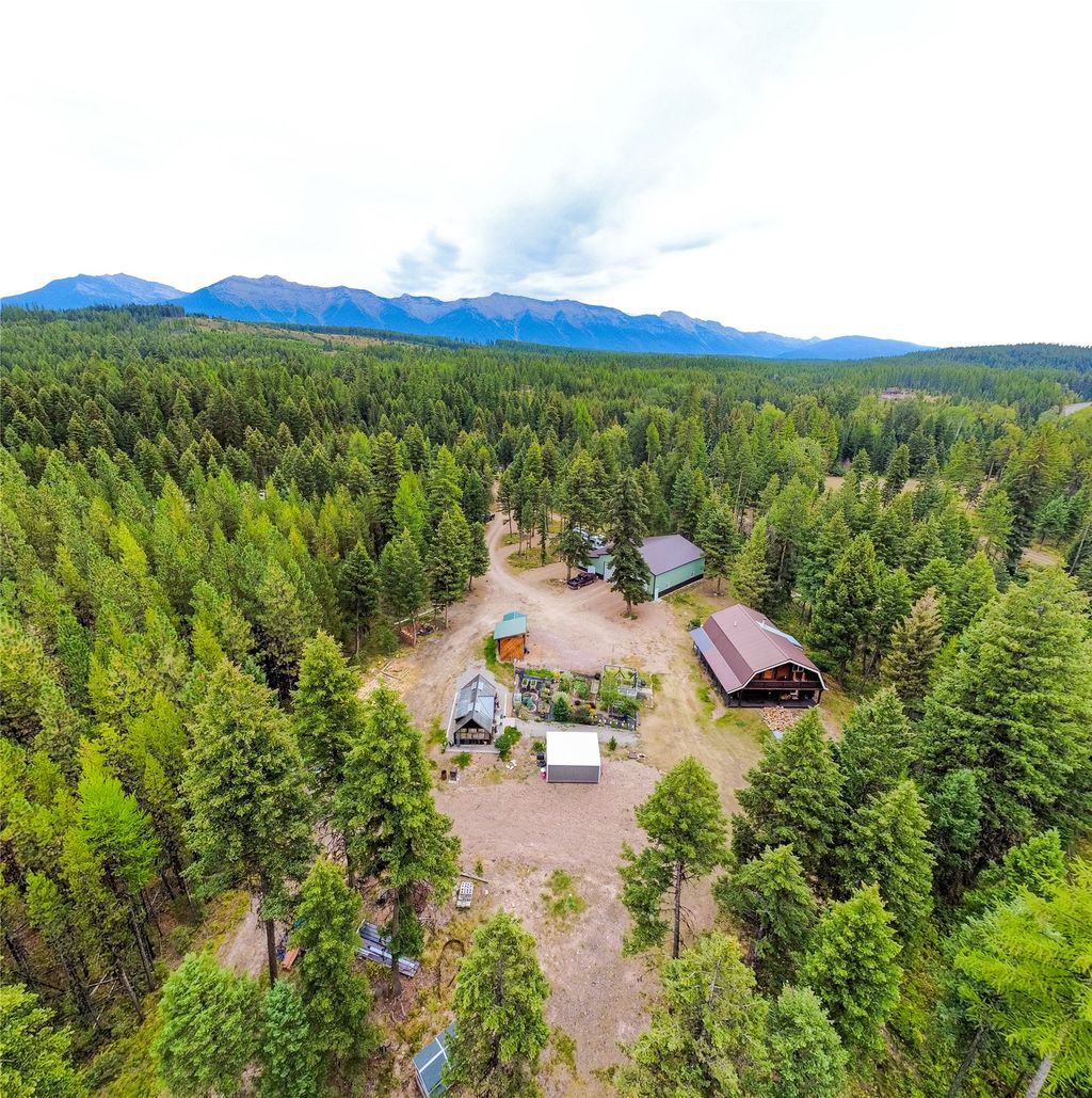 Photo of 5449 Mt-83 N, Seeley Lake, MT 59868 (MLS # 30070115)