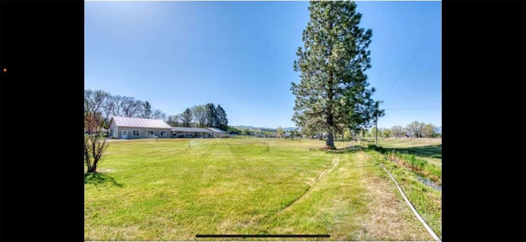 Photo of 810 Sleeping Child Road, Hamilton, MT 59840 (MLS # 30020536)