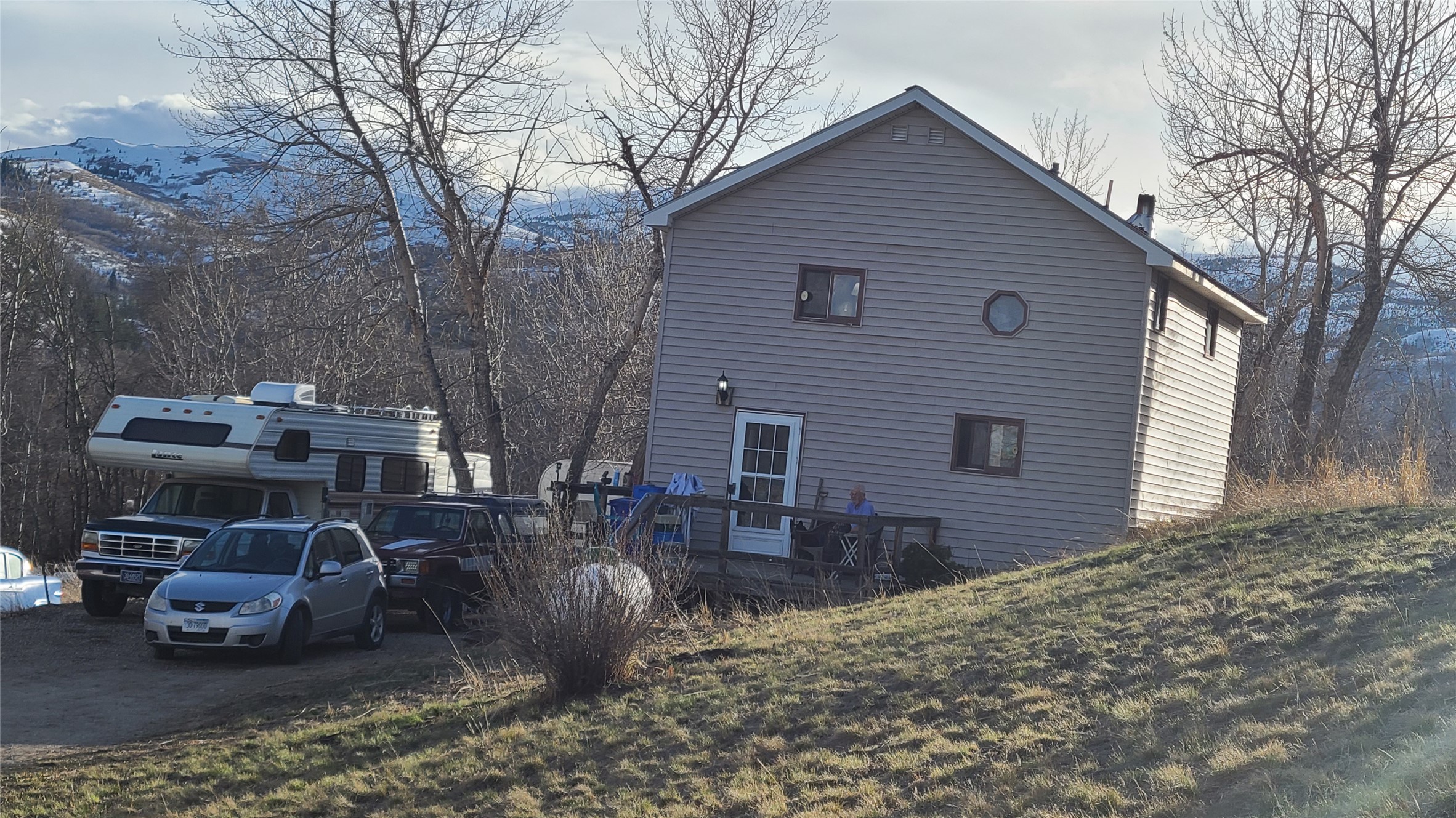 View of side of home featuring a mountain view