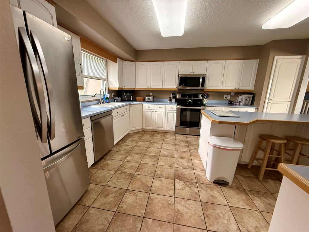 Photo of 1013 26th Avenue SW, Great Falls, MT 59404 (MLS # 30069516)