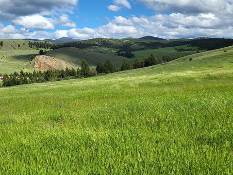 Photo of 65 Gold Coin Road, Hall, MT 59837 (MLS # 30061443)