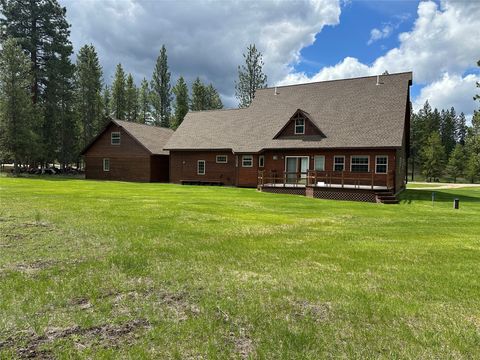 Photo of 170 Drew Creek Loop, Seeley Lake, MT 59868 (MLS # 30070529)