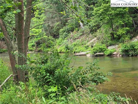 Photo of 867 New River Bend S. Road, Fleetwood, NC 28626 (MLS # 256945) Photo of 867 New River Bend S. Road, Fleetwood, NC 28626 (MLS # 256945)