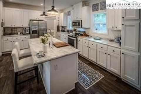 Photo of 211 & 213 Wild Daisy Lane, Banner Elk, NC 28604 (MLS # 260100)