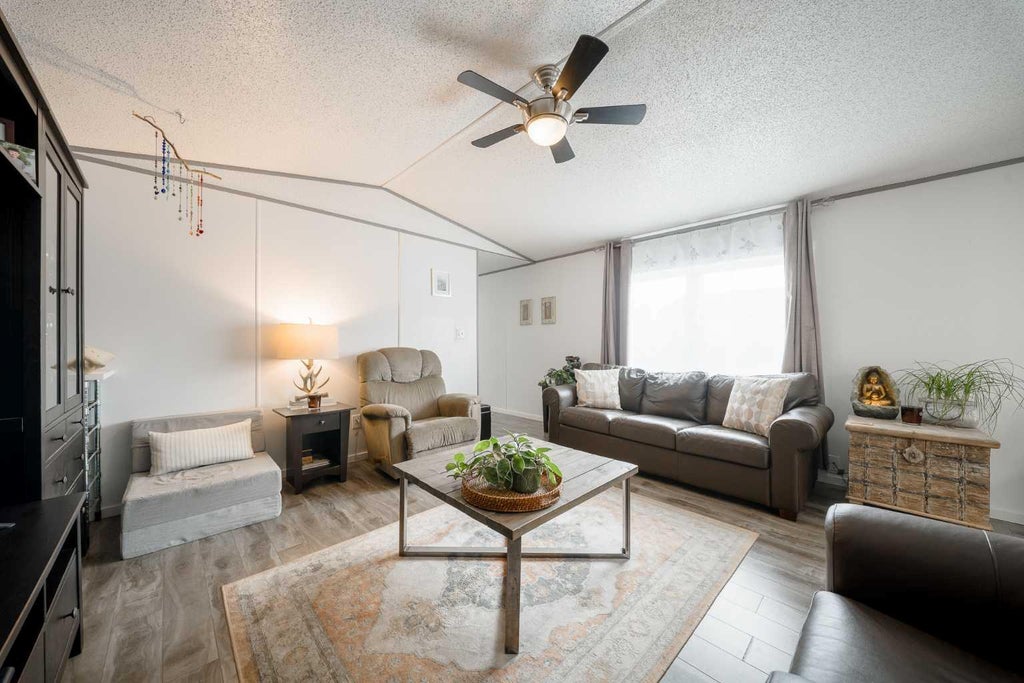 Photo of 105 Heritage Drive, Okotoks, AB T1S 1M4 (MLS # A2347611)
