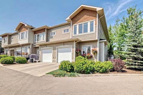 Photo of 12 Cougar Ridge Landing SW, Calgary, AB T3H 0X8 (MLS # A2277045)