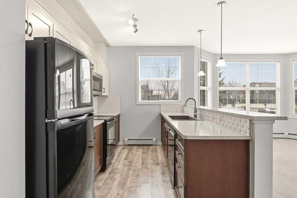 Photo of 1 Crystal Green Lane #137, Okotoks, AB T1S 0C5 (MLS # A2303248)