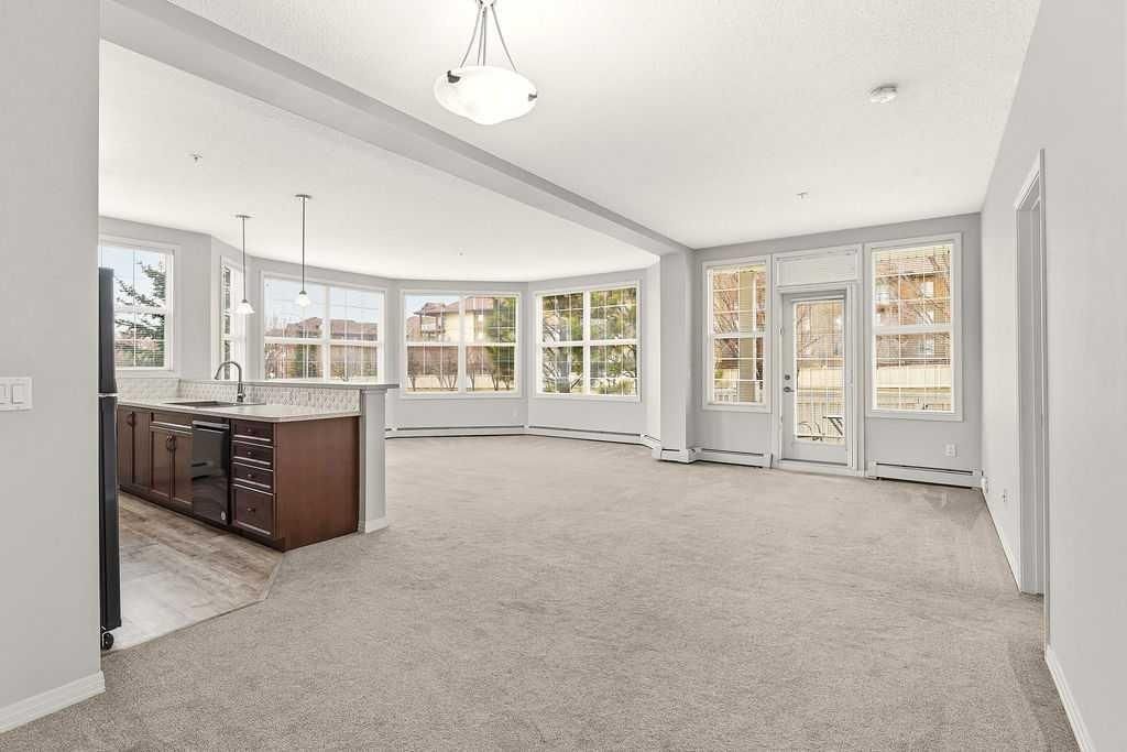 Photo of 1 Crystal Green Lane #137, Okotoks, AB T1S 0C5 (MLS # A2303248)