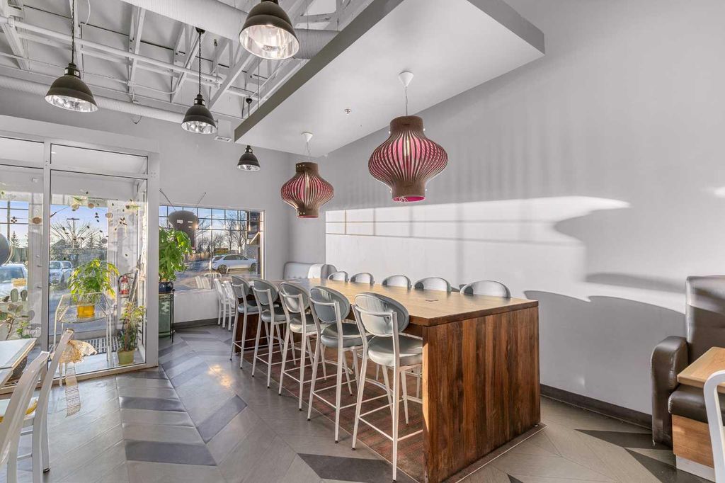 Photo of 1851 Sirocco Drive SW #104, Calgary, AB T3H 4R5 (MLS # A2284291)