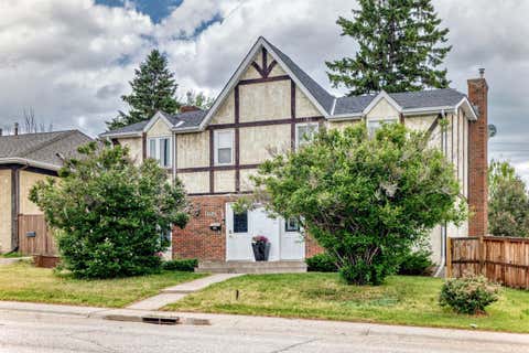 Photo of 11169 Sacramento Drive SW, Calgary, AB T2W 0J6 (MLS # A2318543)