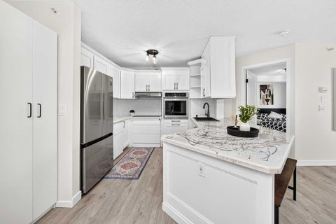 Photo of 4000 Somervale Court SW #411, Calgary, AB T2Y 4J3 (MLS # A2330051)
