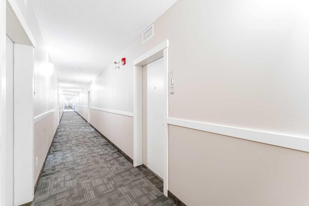 Photo of 6703 New Brighton Avenue SE #103, Calgary, AB T2Z 5C8 (MLS # A2318359)