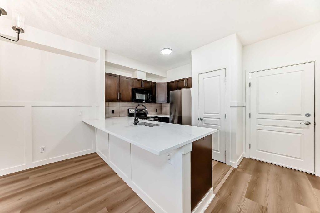 Photo of 22 Panatella Road NW #101, Calgary, AB T3K 0V4 (MLS # A2290846)