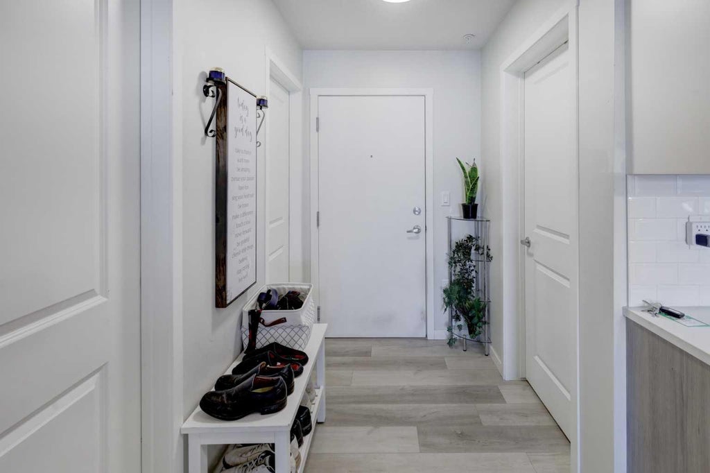 Photo of 360 Harvest Hills Way NE #106, Calgary, AB T3K 2S1 (MLS # A2348147)