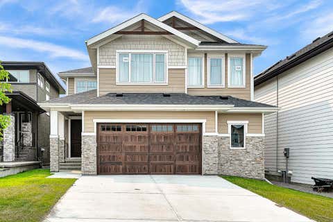 Photo of 406 Rowley Way NW, Calgary, AB T3L 0G5 (MLS # A2336787)