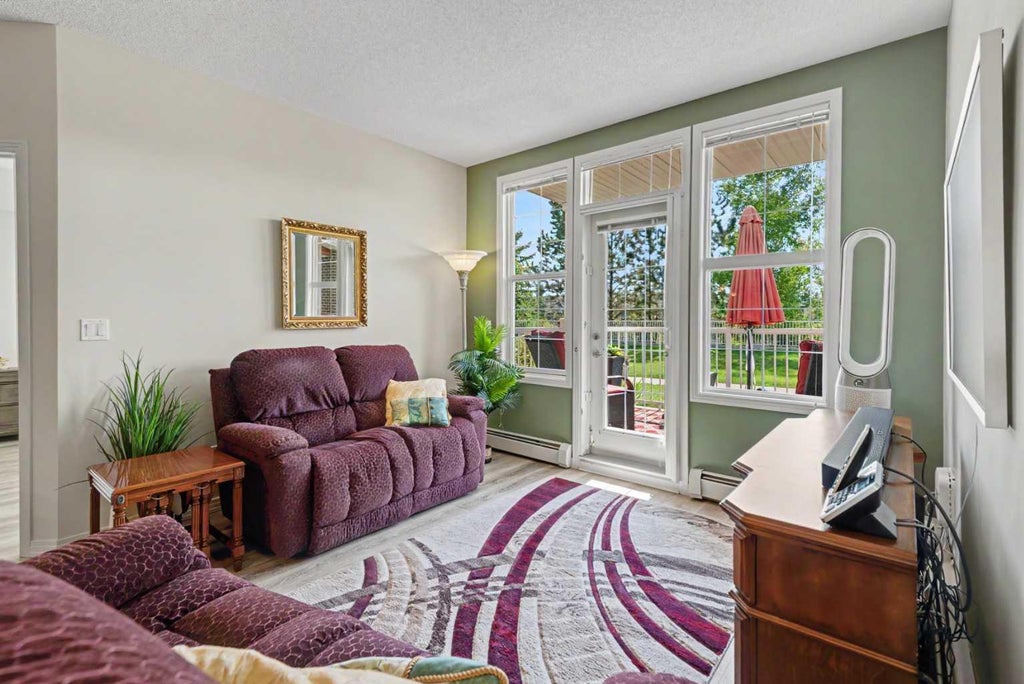 Photo of 1 Crystal Green Ln #116, Okotoks, AB T1S 0C5 (MLS # A2340505)