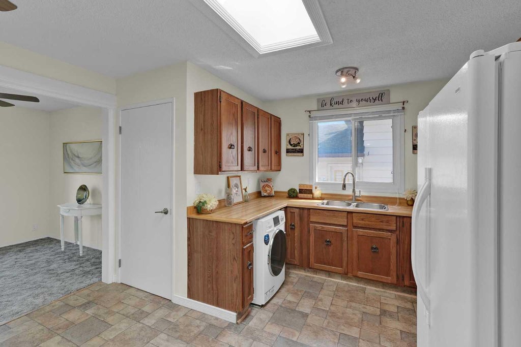 Photo of 27 Bedridge Way NE, Calgary, AB T3K 1M2 (MLS # A2335133)